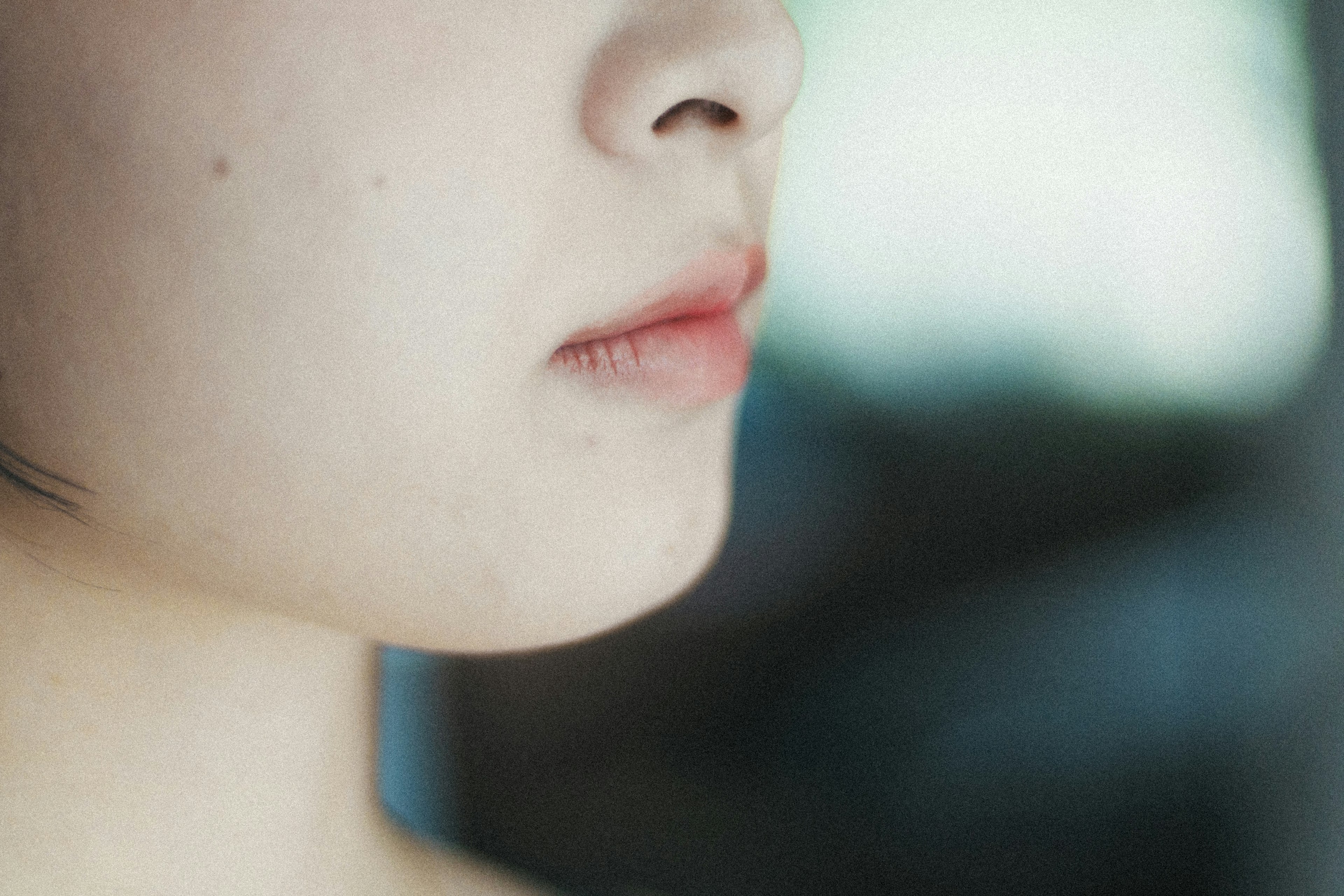 Close-up of a woman's profile featuring soft skin tones