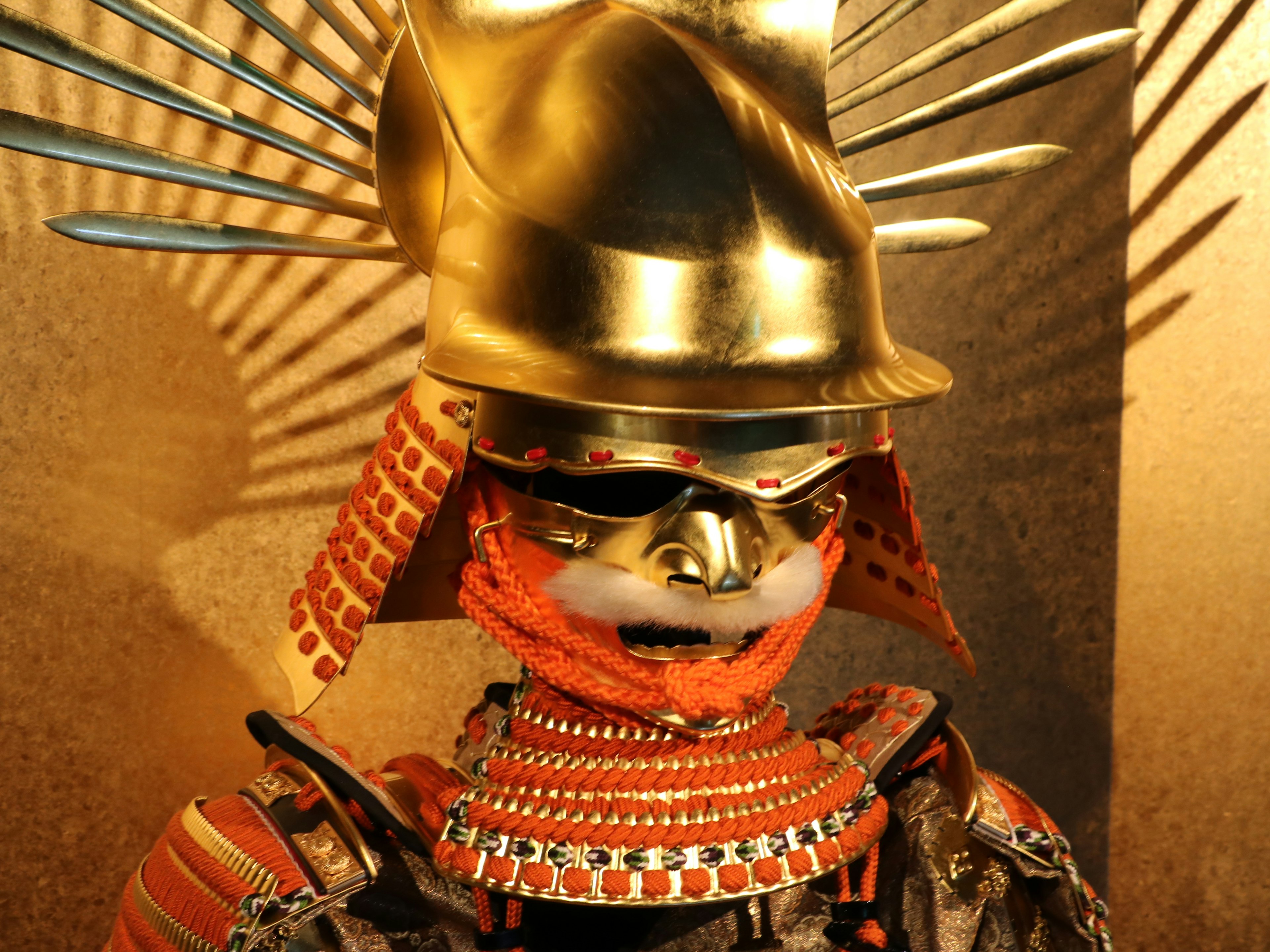 Detailed display of a samurai armor with a golden helmet