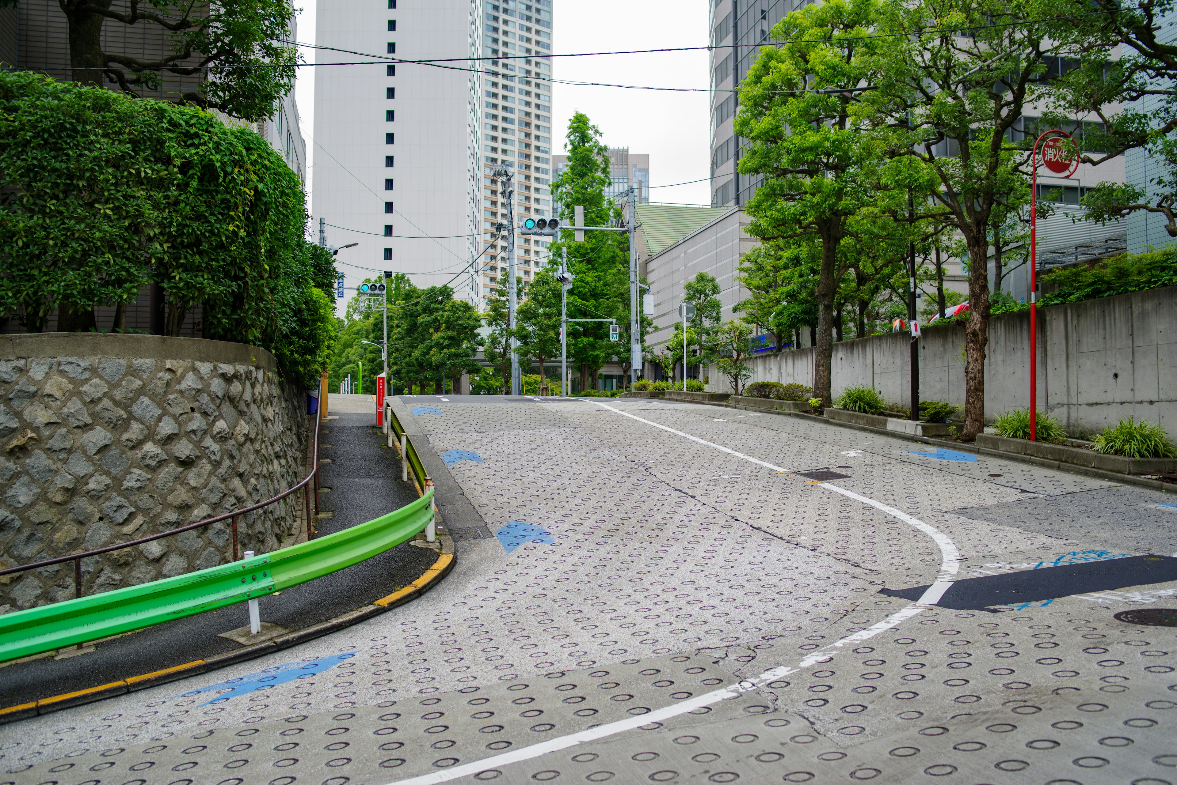 Curved road with green landscaping in an urban setting