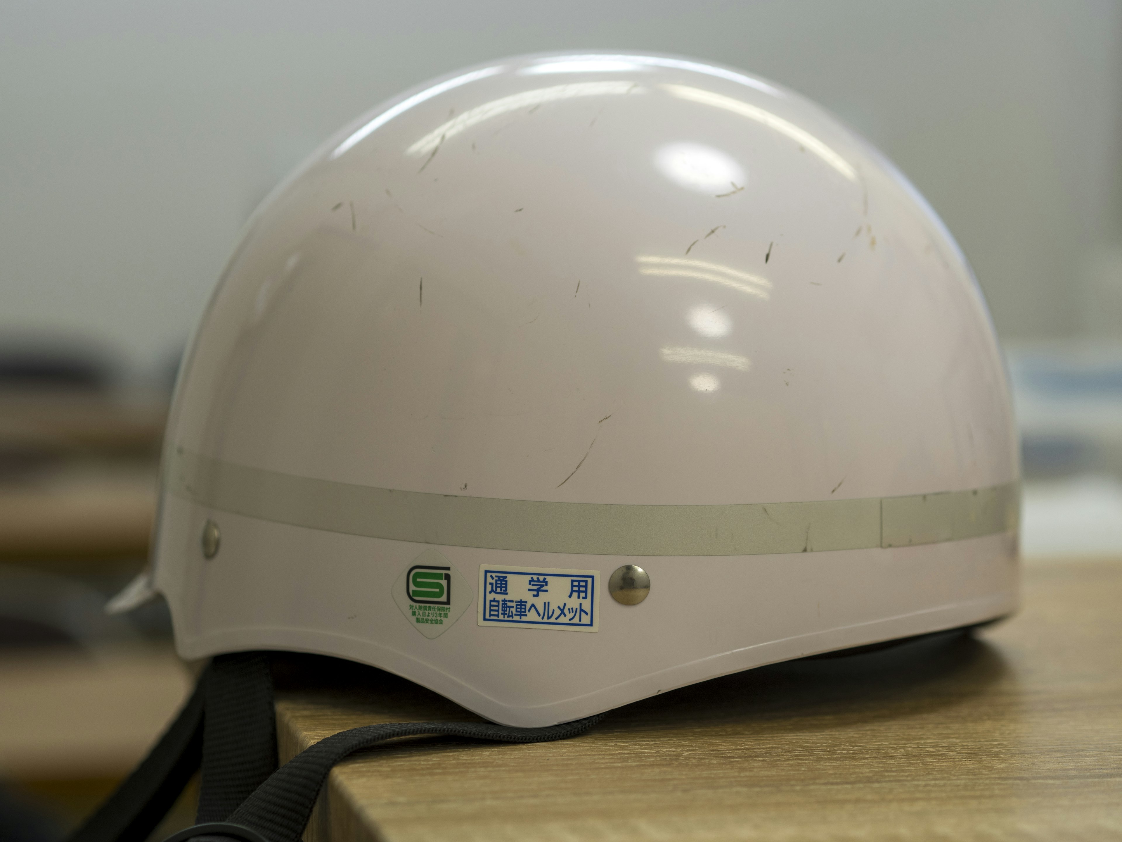 White helmet placed on a table