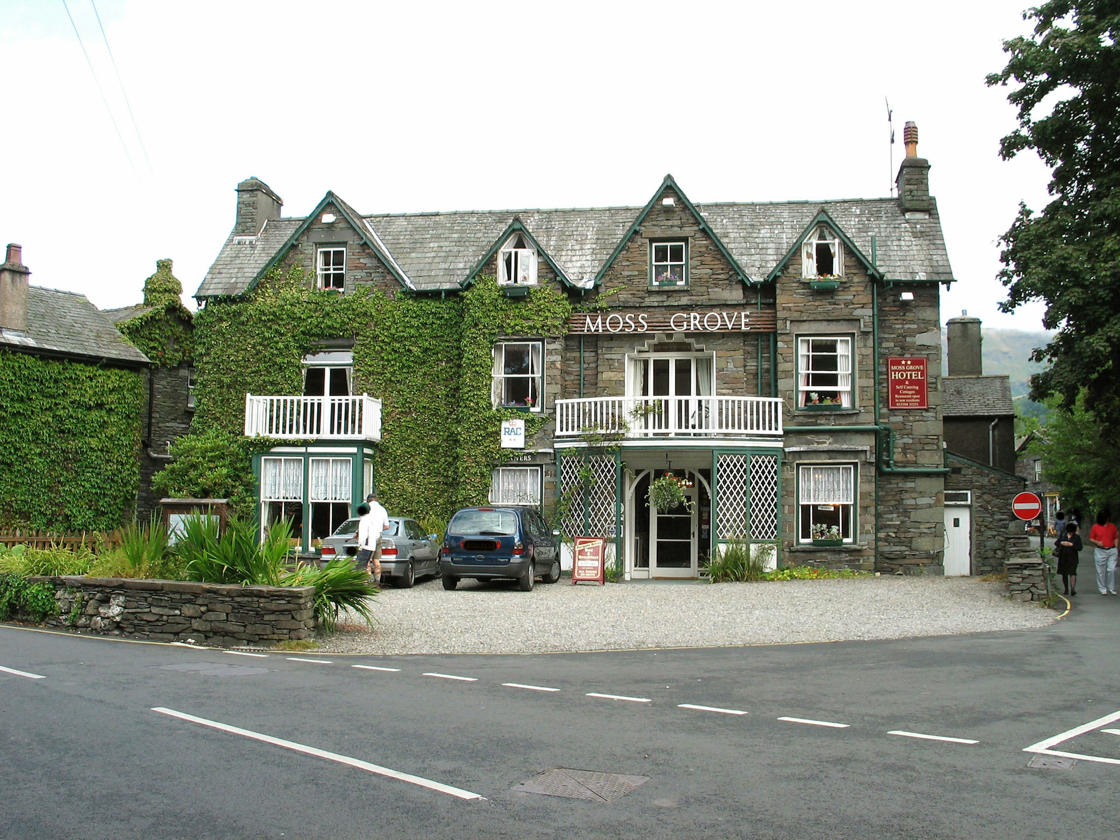 Moss Grove building covered in green ivy with surrounding road