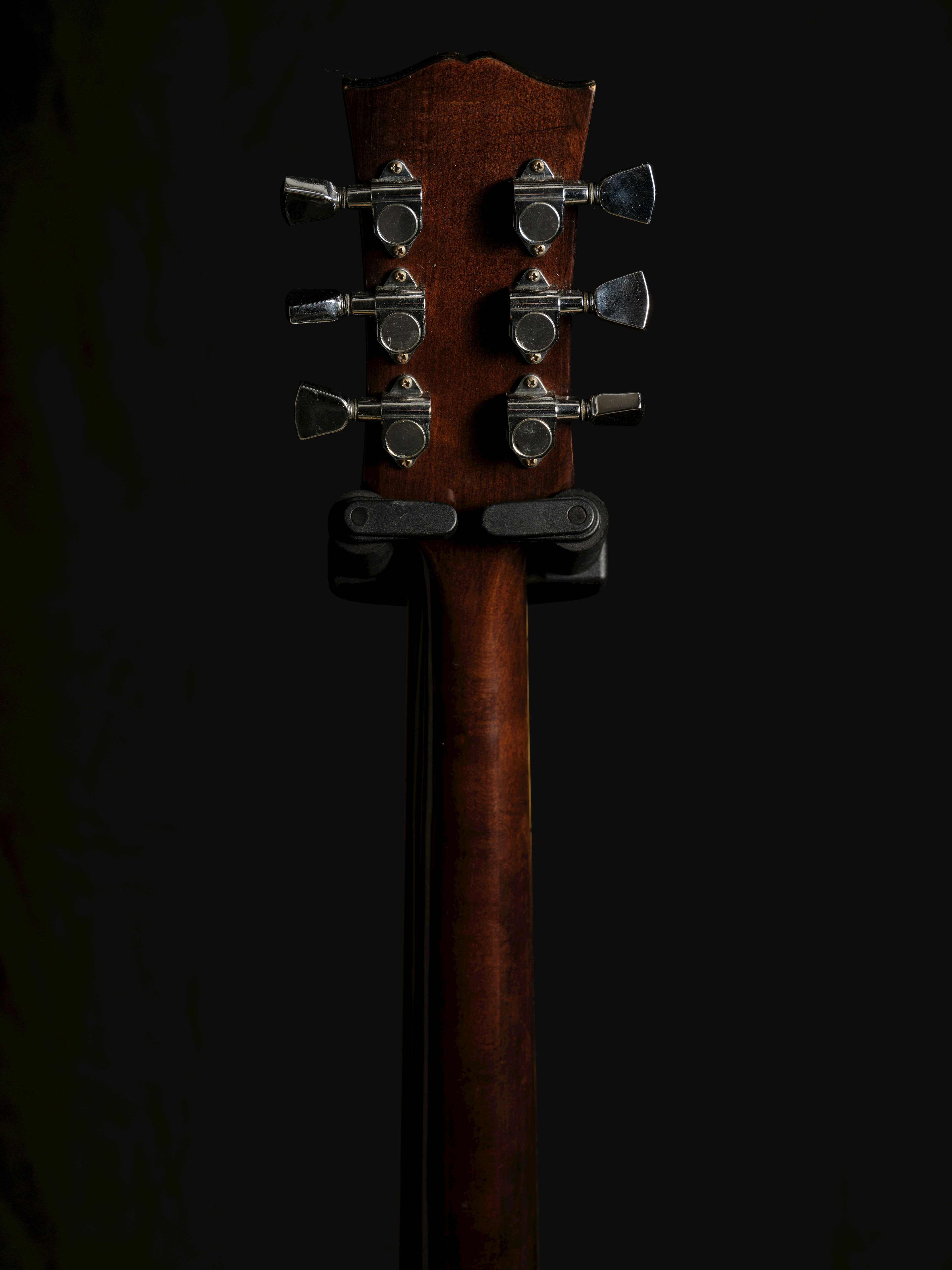 Close-up image of an acoustic guitar headstock