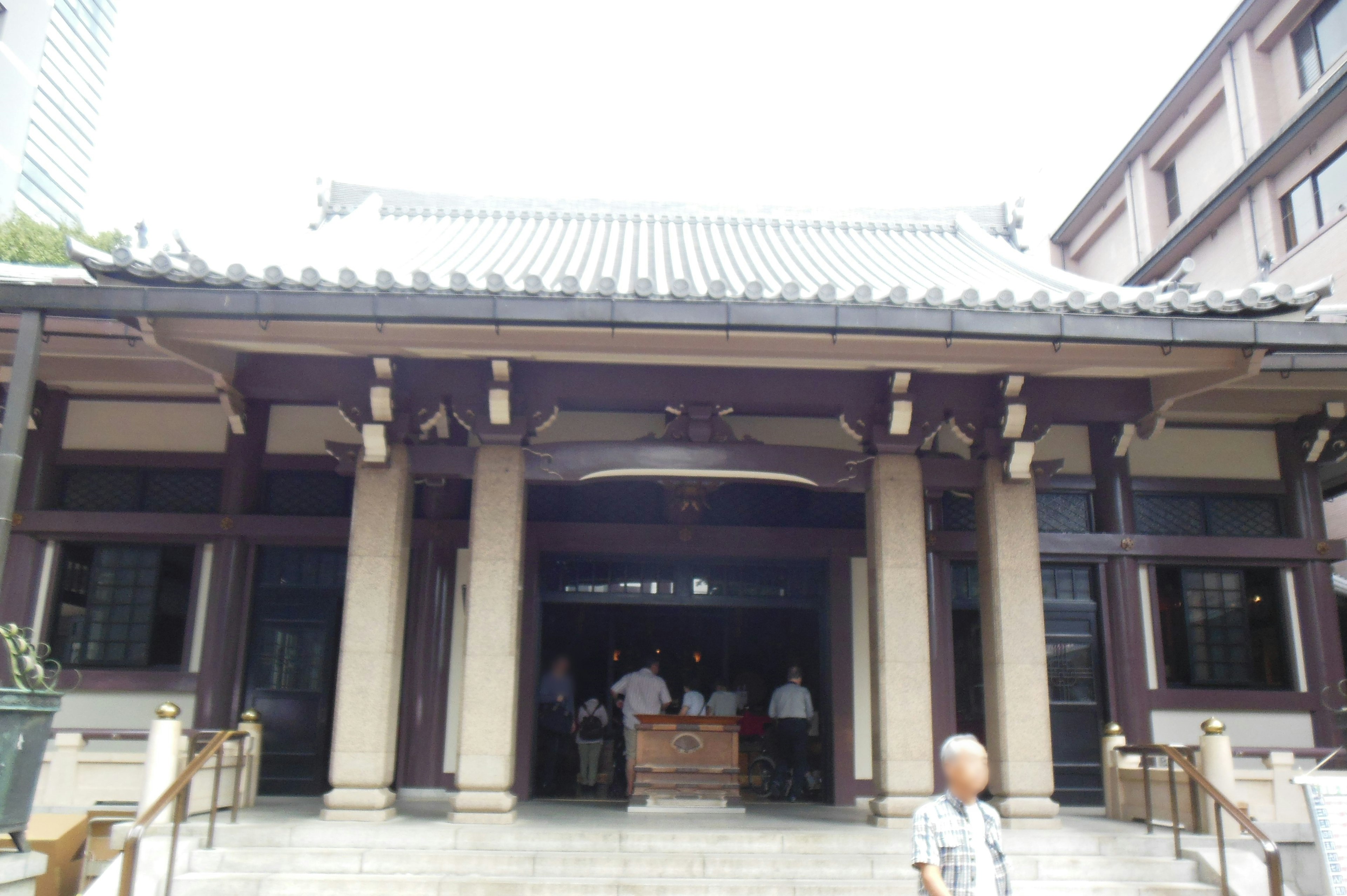 Entrance of a traditional Japanese temple with wooden pillars