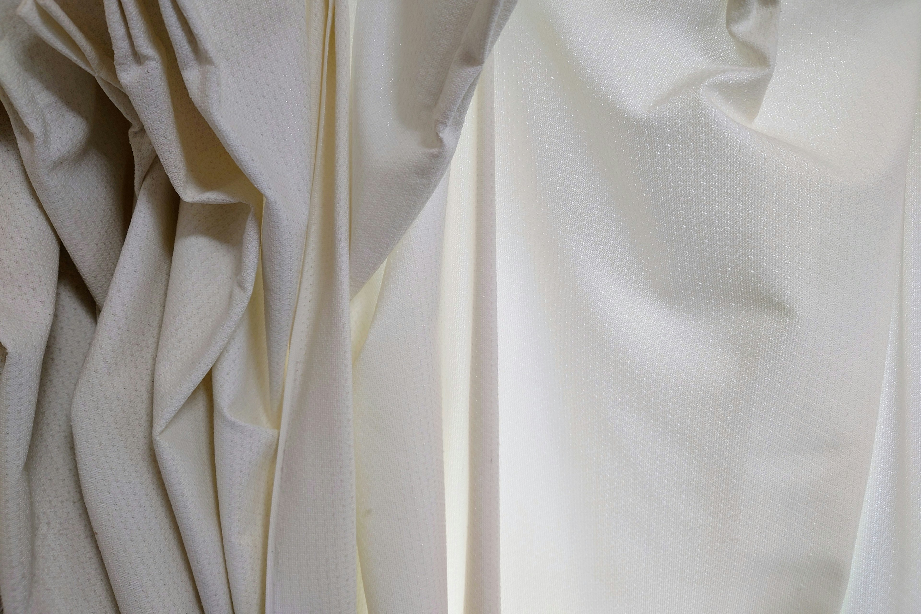 Close-up of white curtains with soft folds and textures