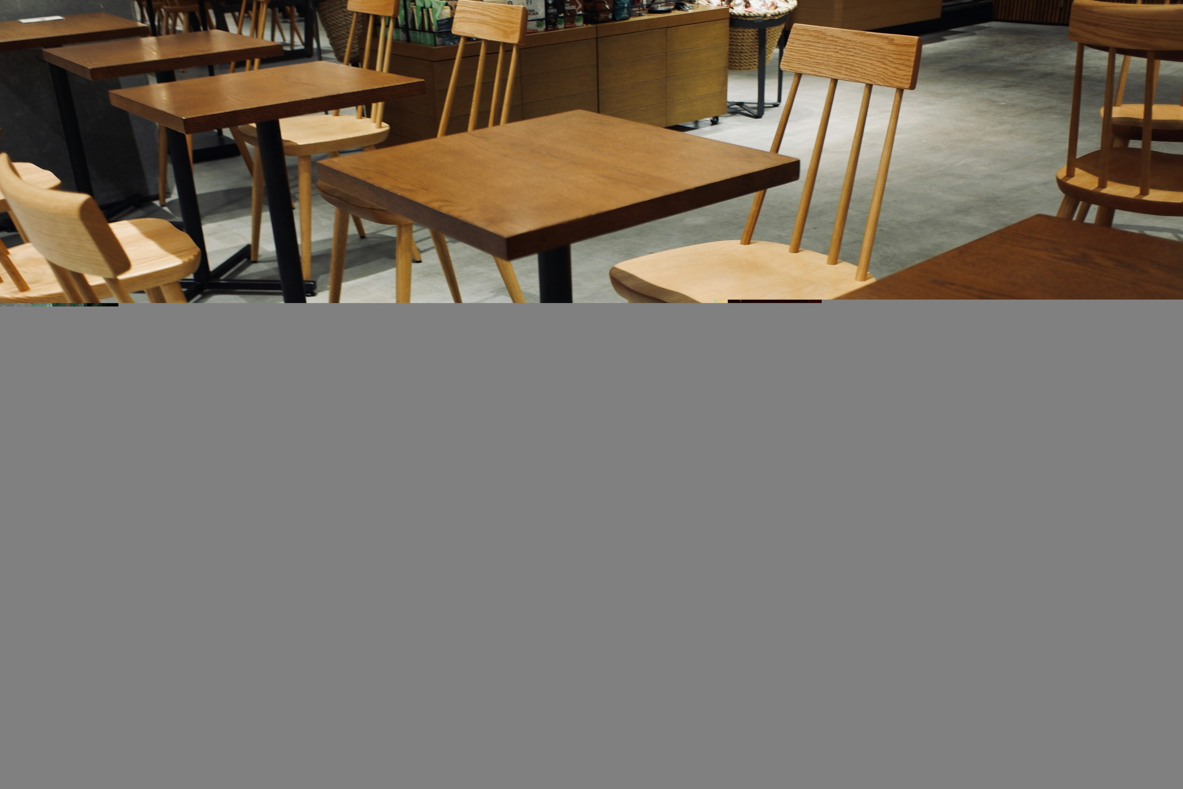 Interior of a cafe with wooden tables and chairs