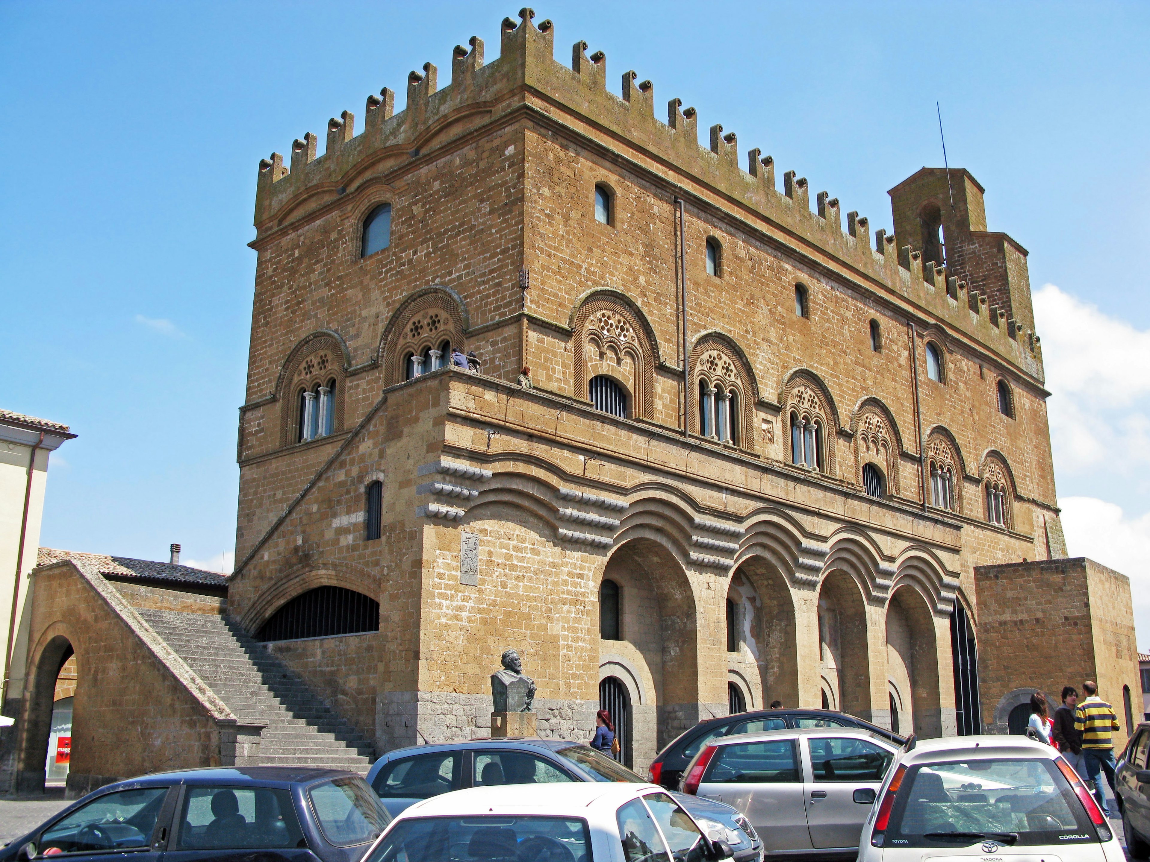 Historic building with a unique façade and surrounding cars