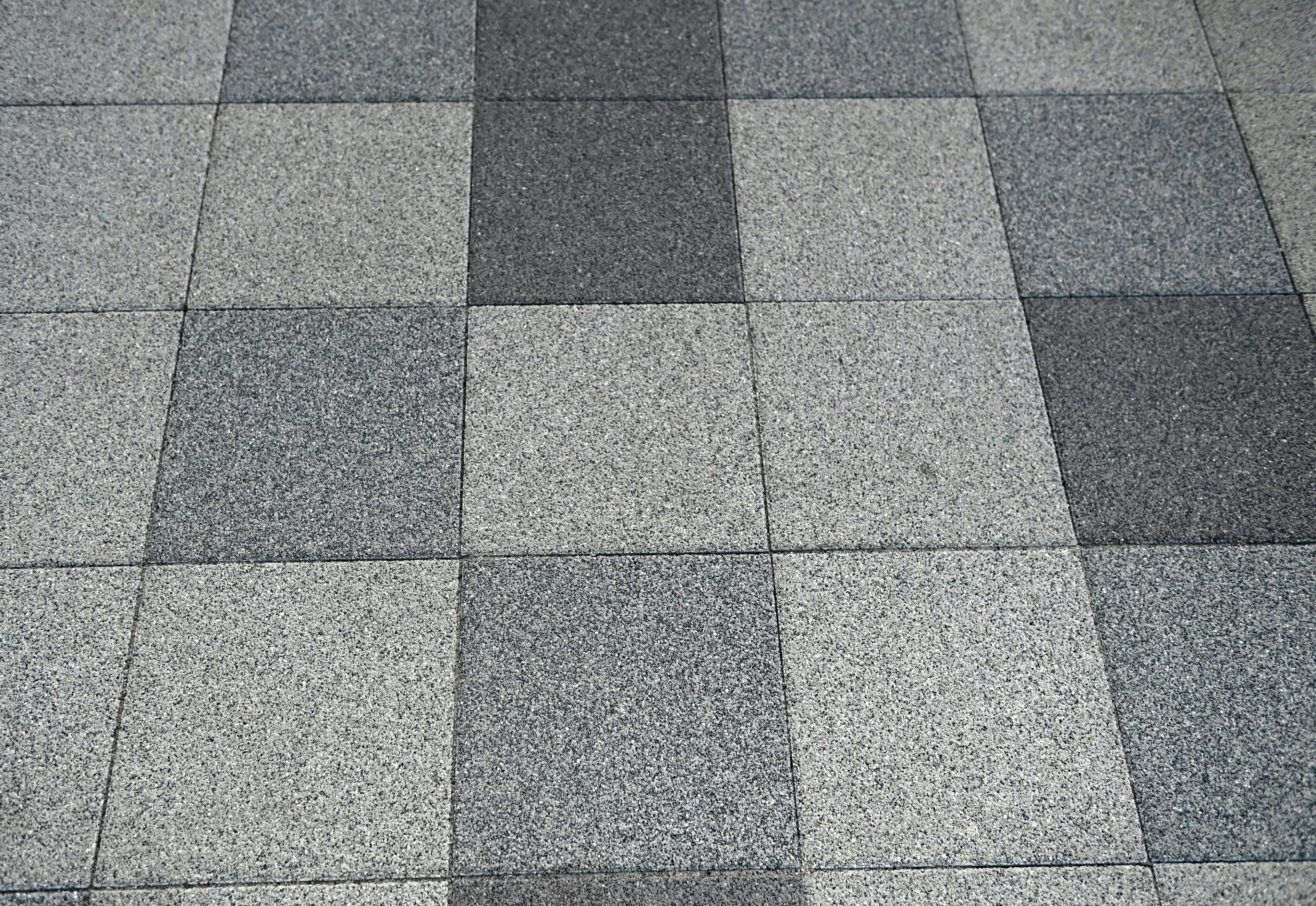 Floor pattern of gray tiles arranged in a random layout