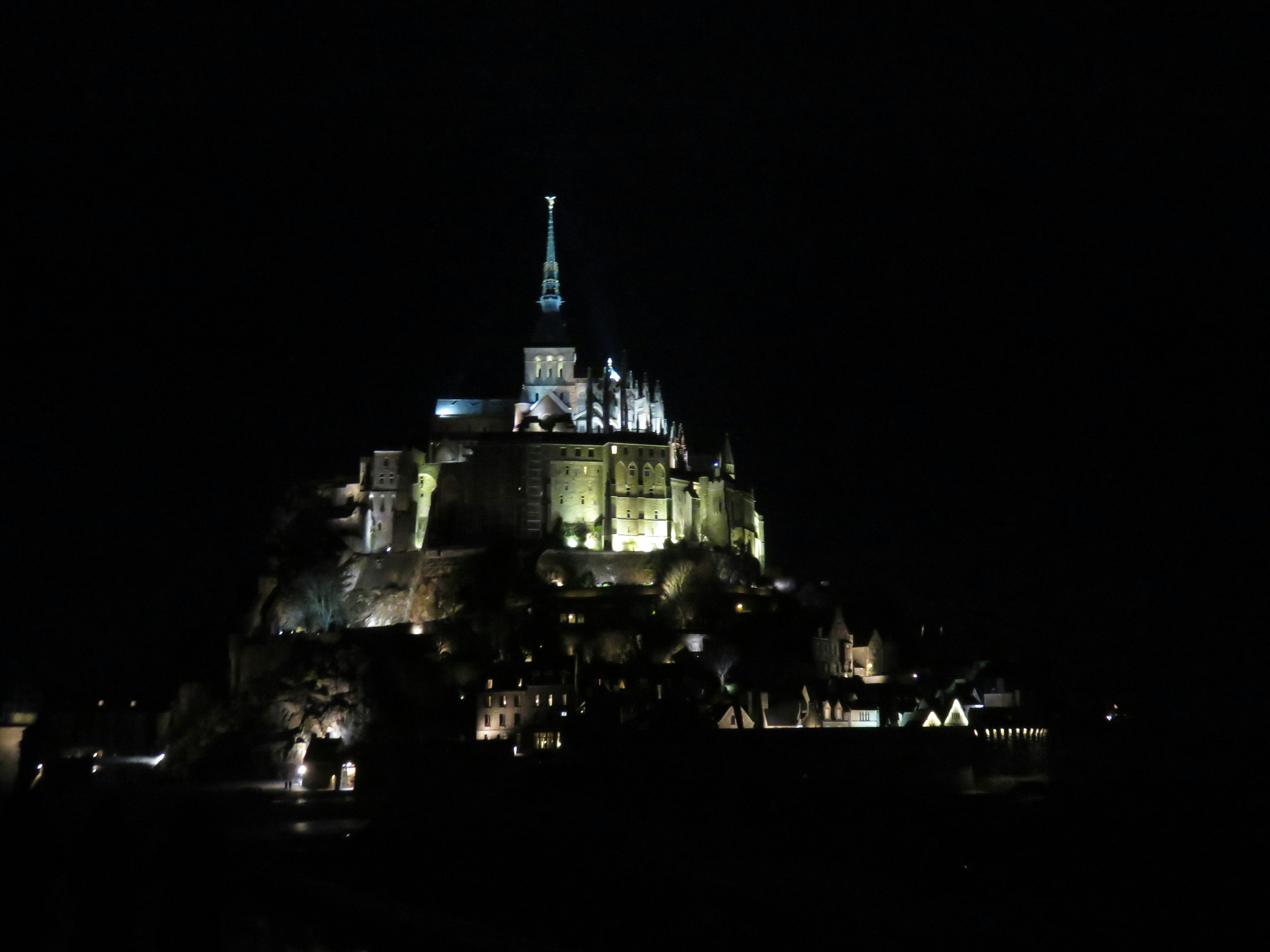 Illuminated Mont Saint-Michel at night showcasing its stunning architecture