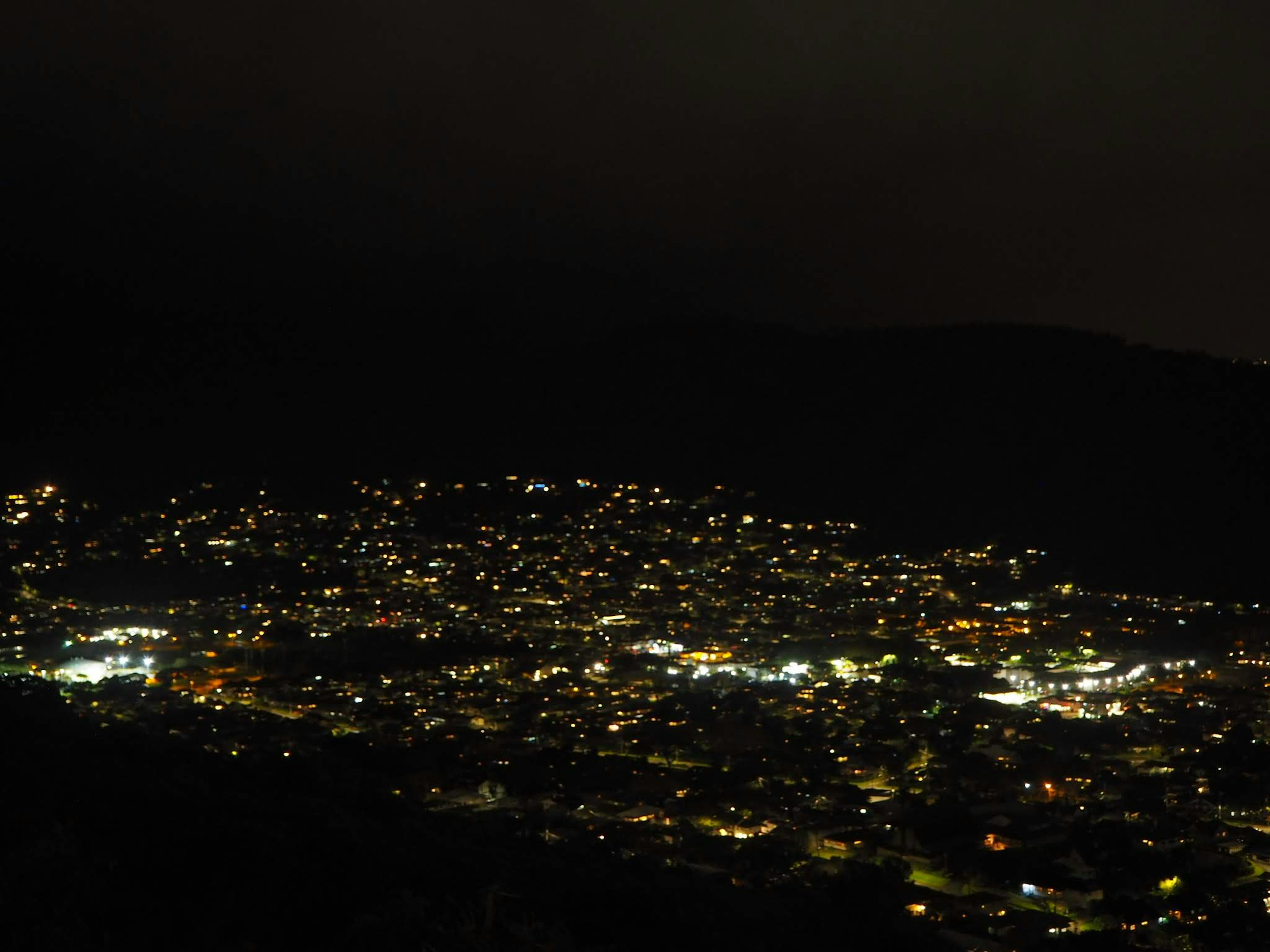 A town illuminated at night with scattered lights