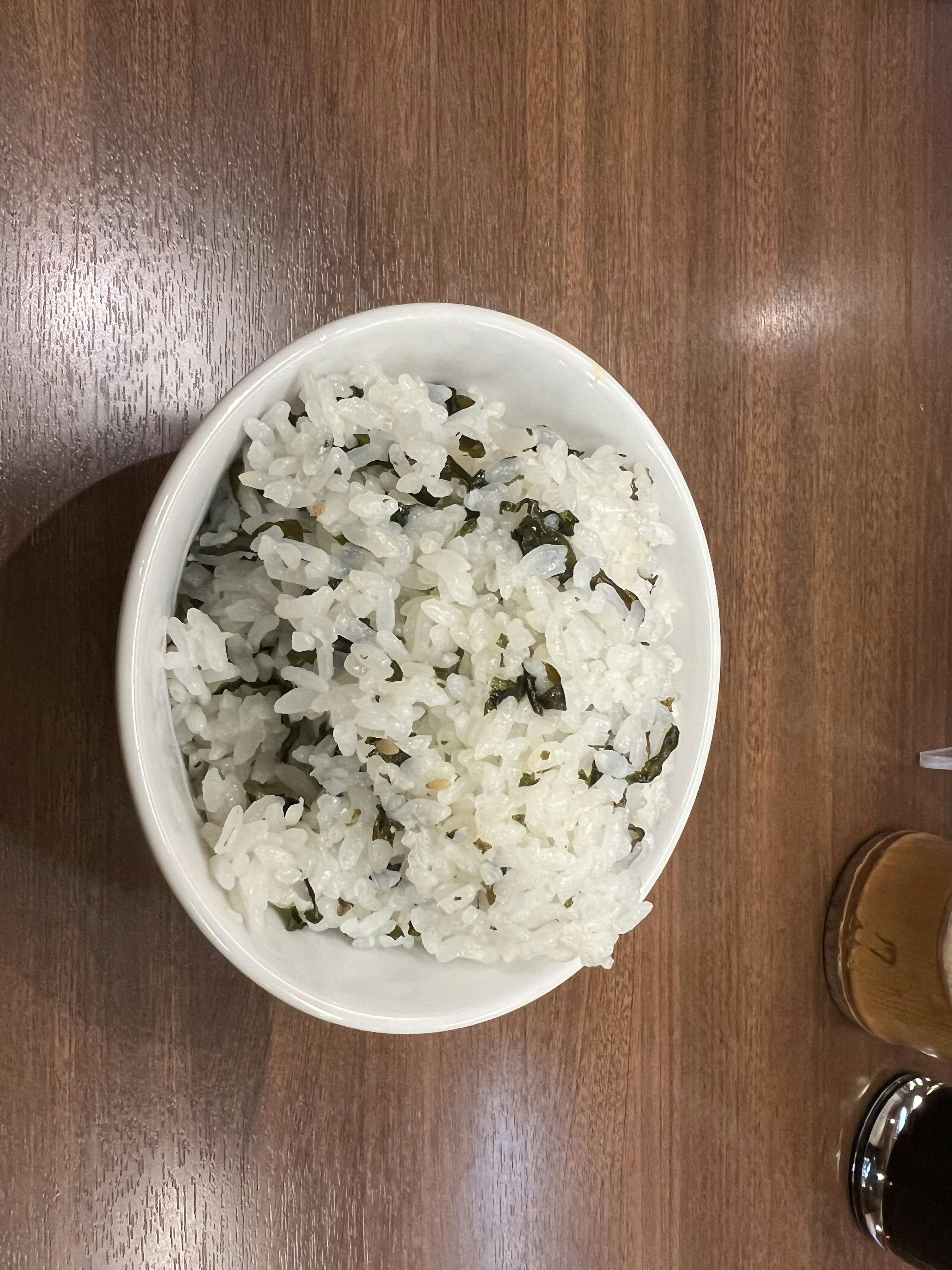 Bowl of white rice mixed with seaweed