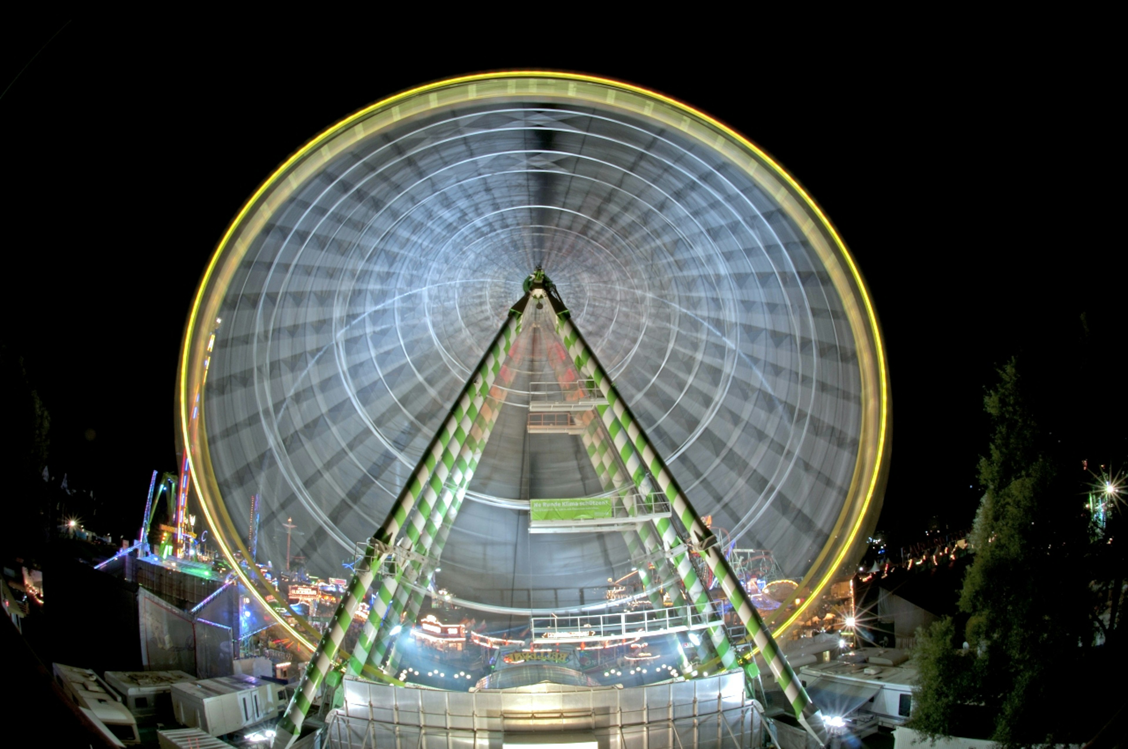 Vibrant illuminated Ferris wheel at night