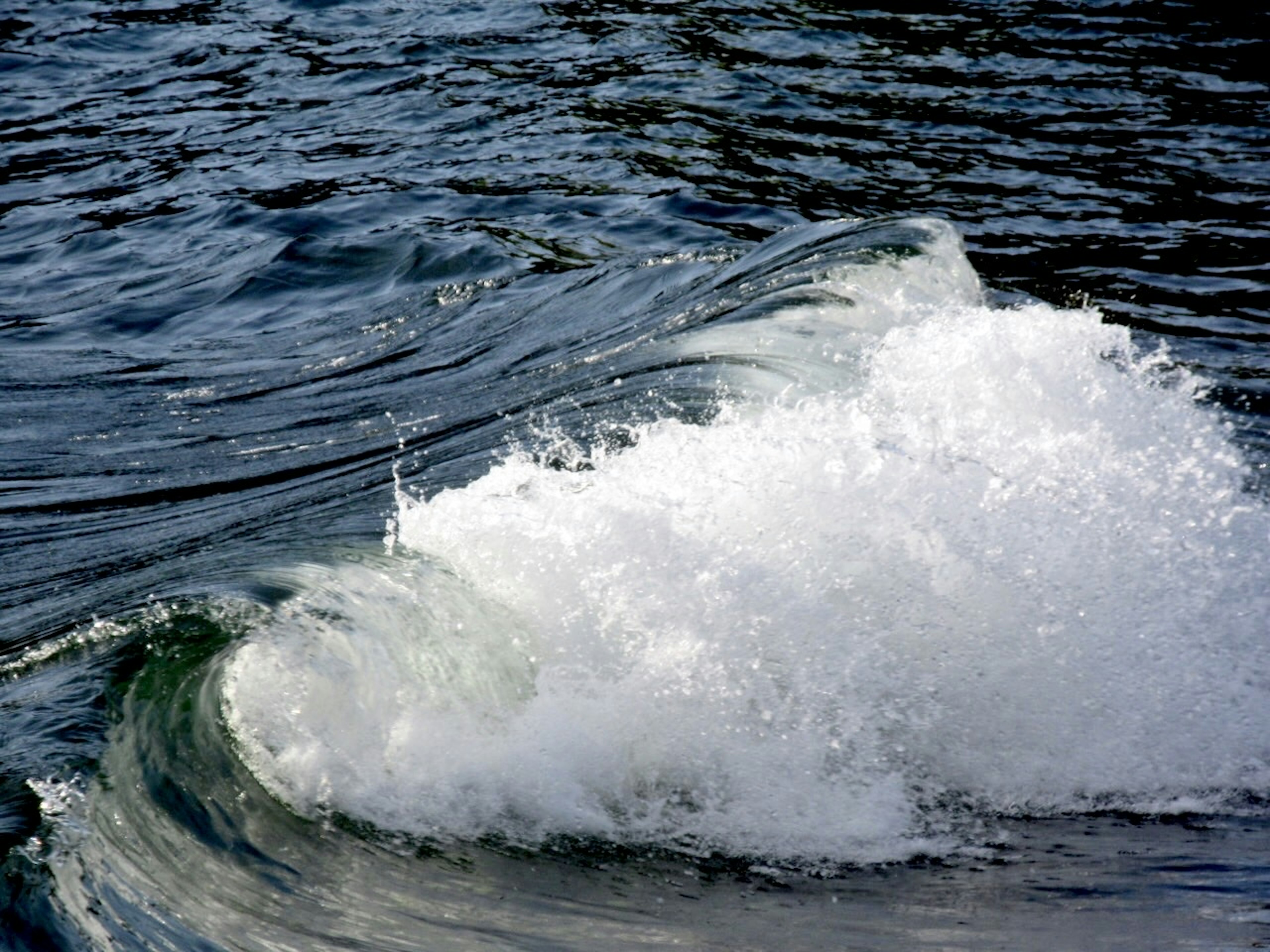 Waves forming on the water surface with splashes