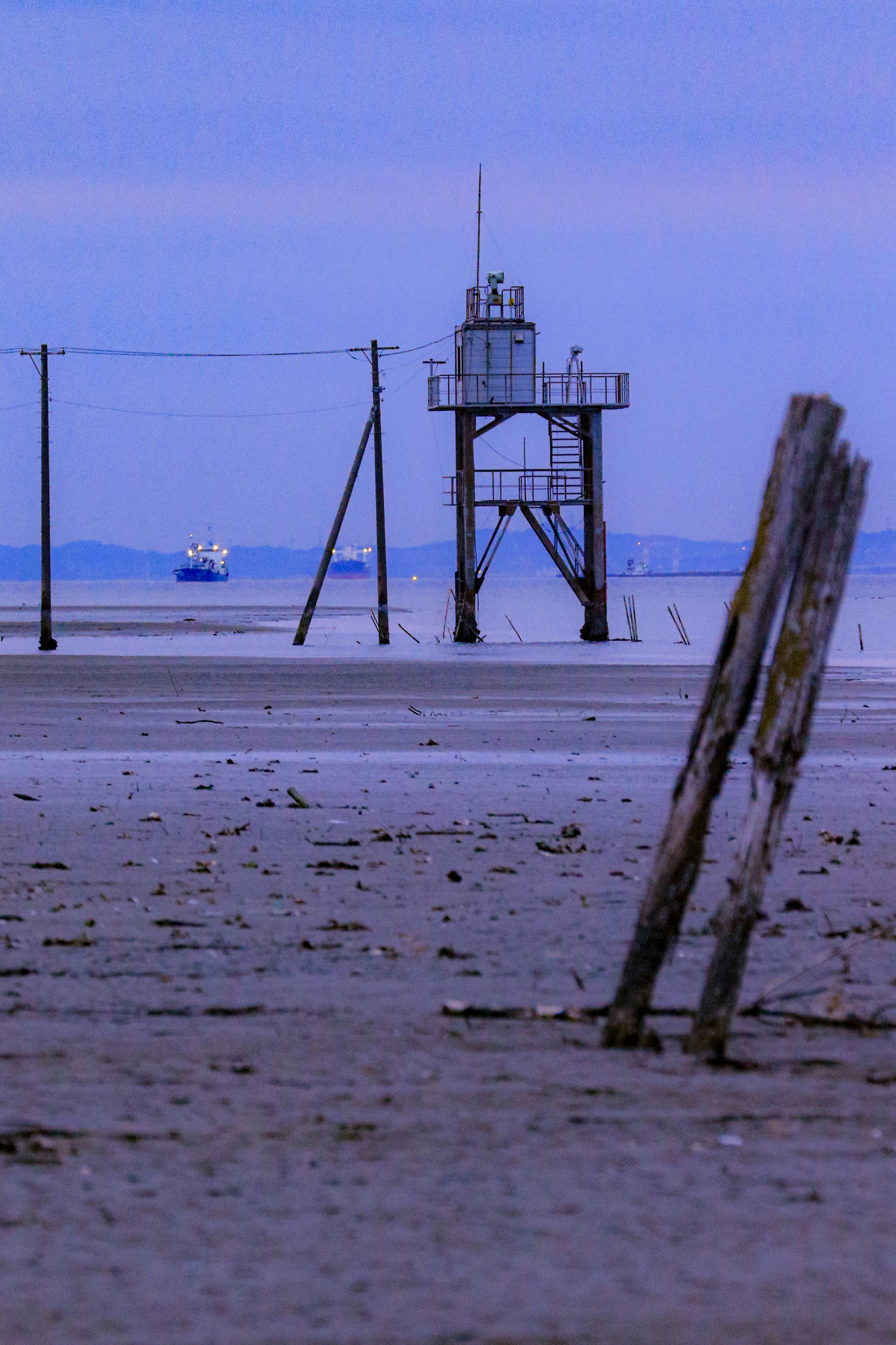 Coastal scene with a lighthouse and low tide