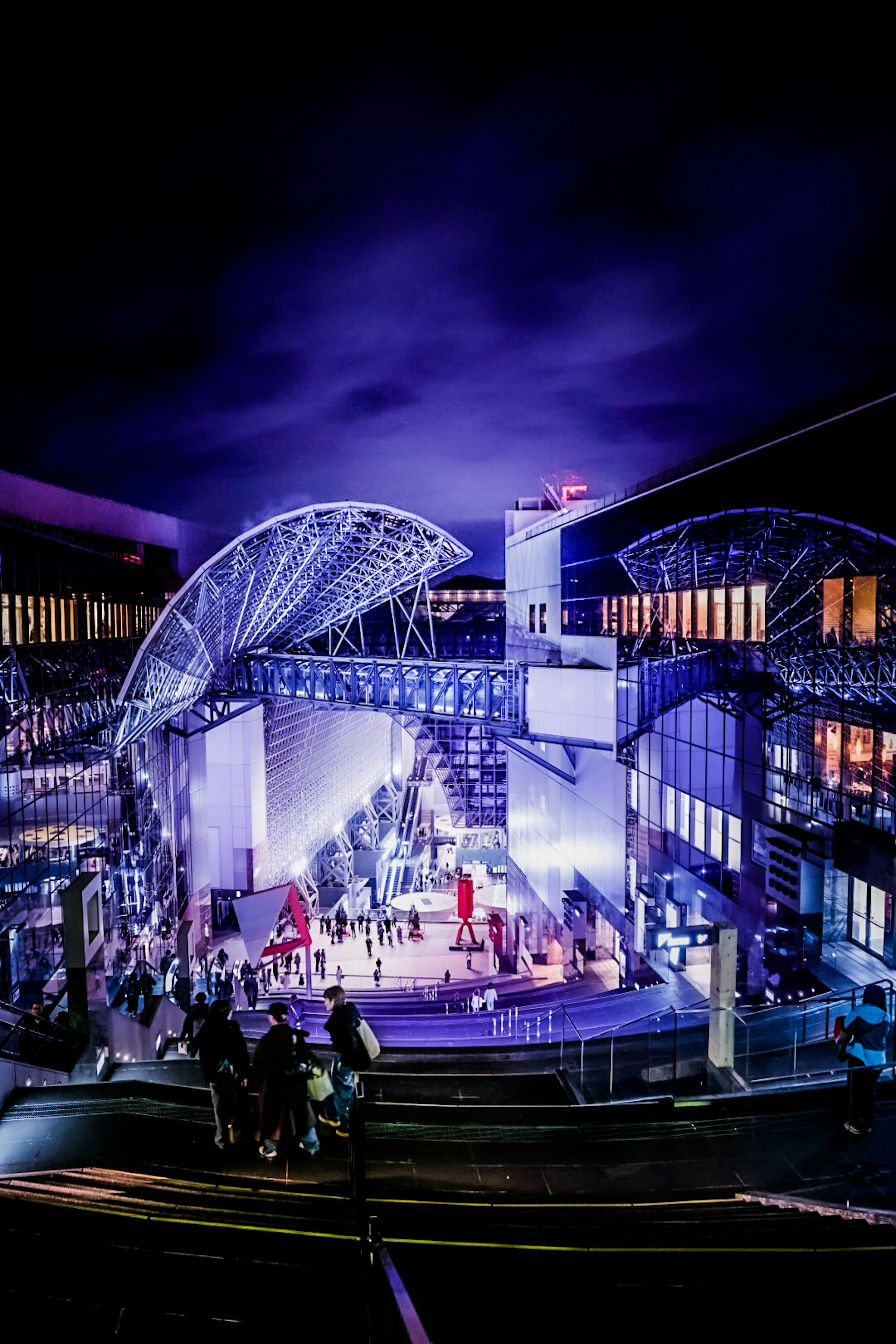 Outdoor stage hosting a night performance with an audience