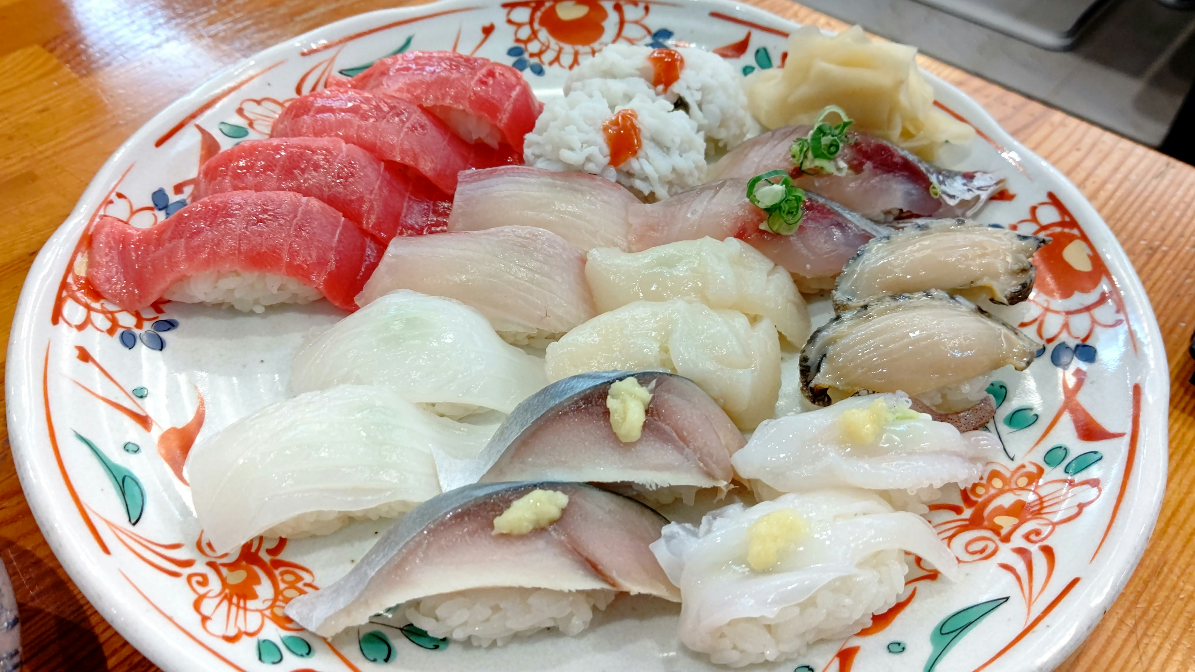 A beautifully arranged sushi platter with various types of sushi