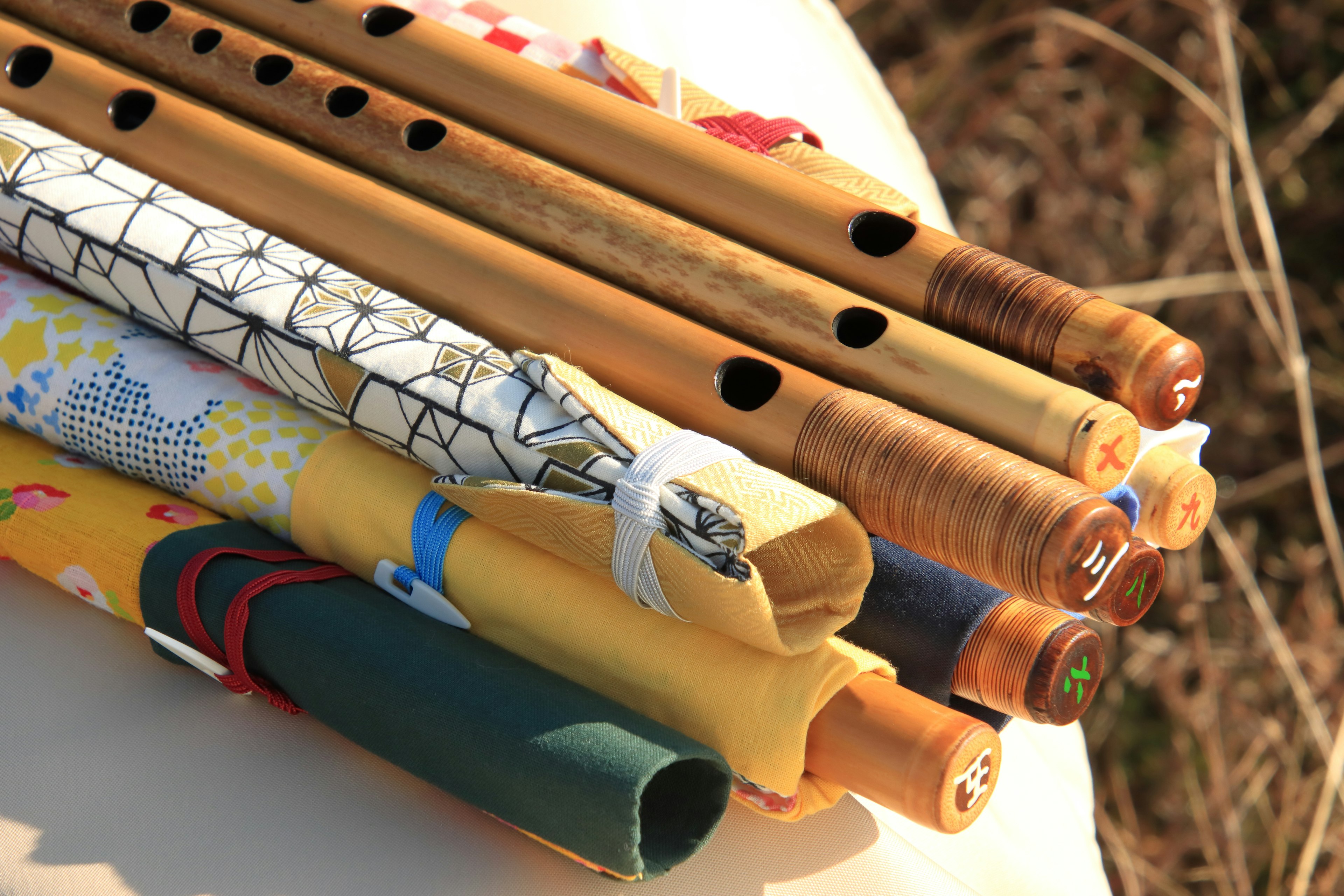 A collection of colorful flutes with unique designs and patterns