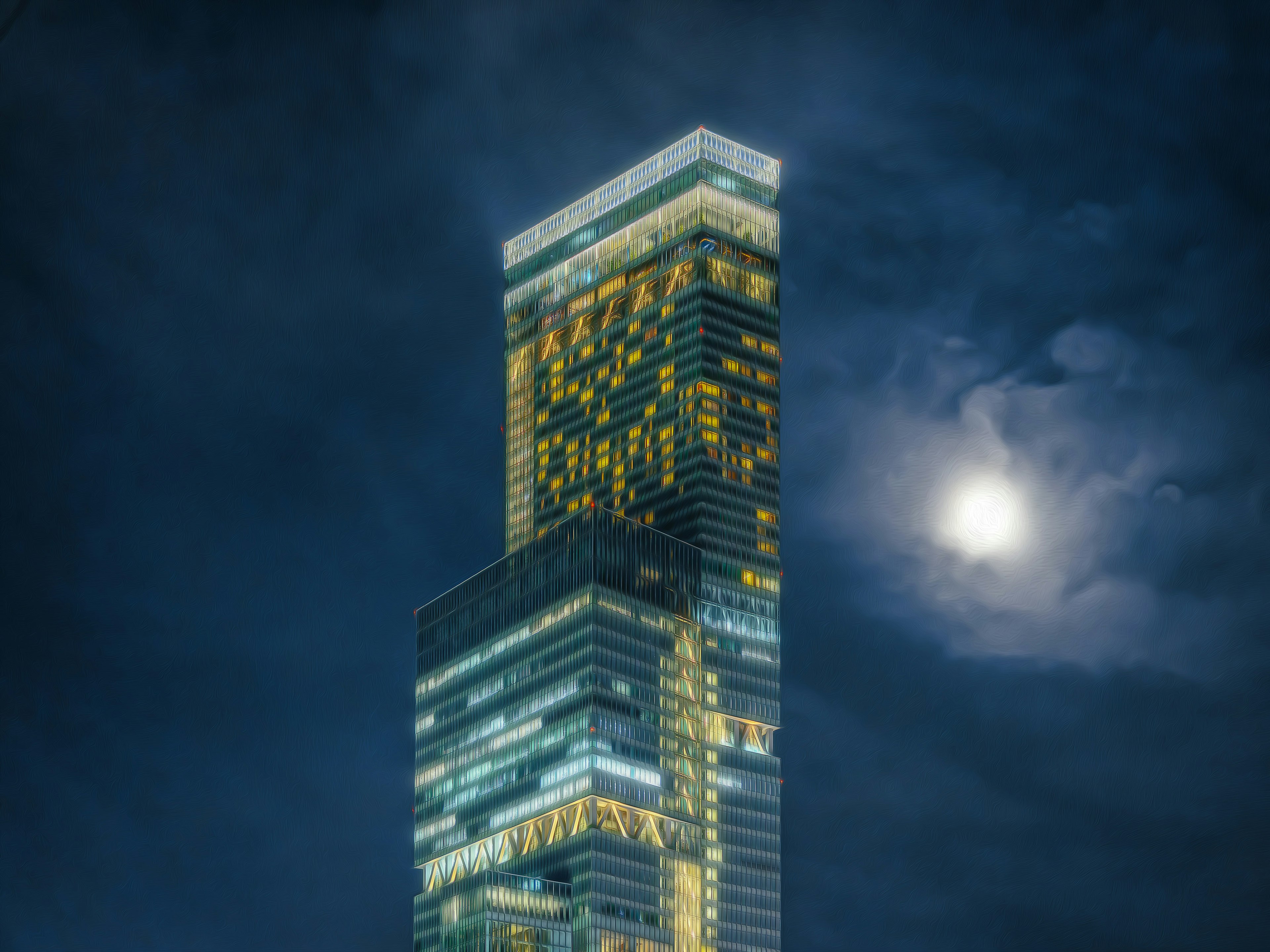 Illuminated skyscraper against a night sky with moon