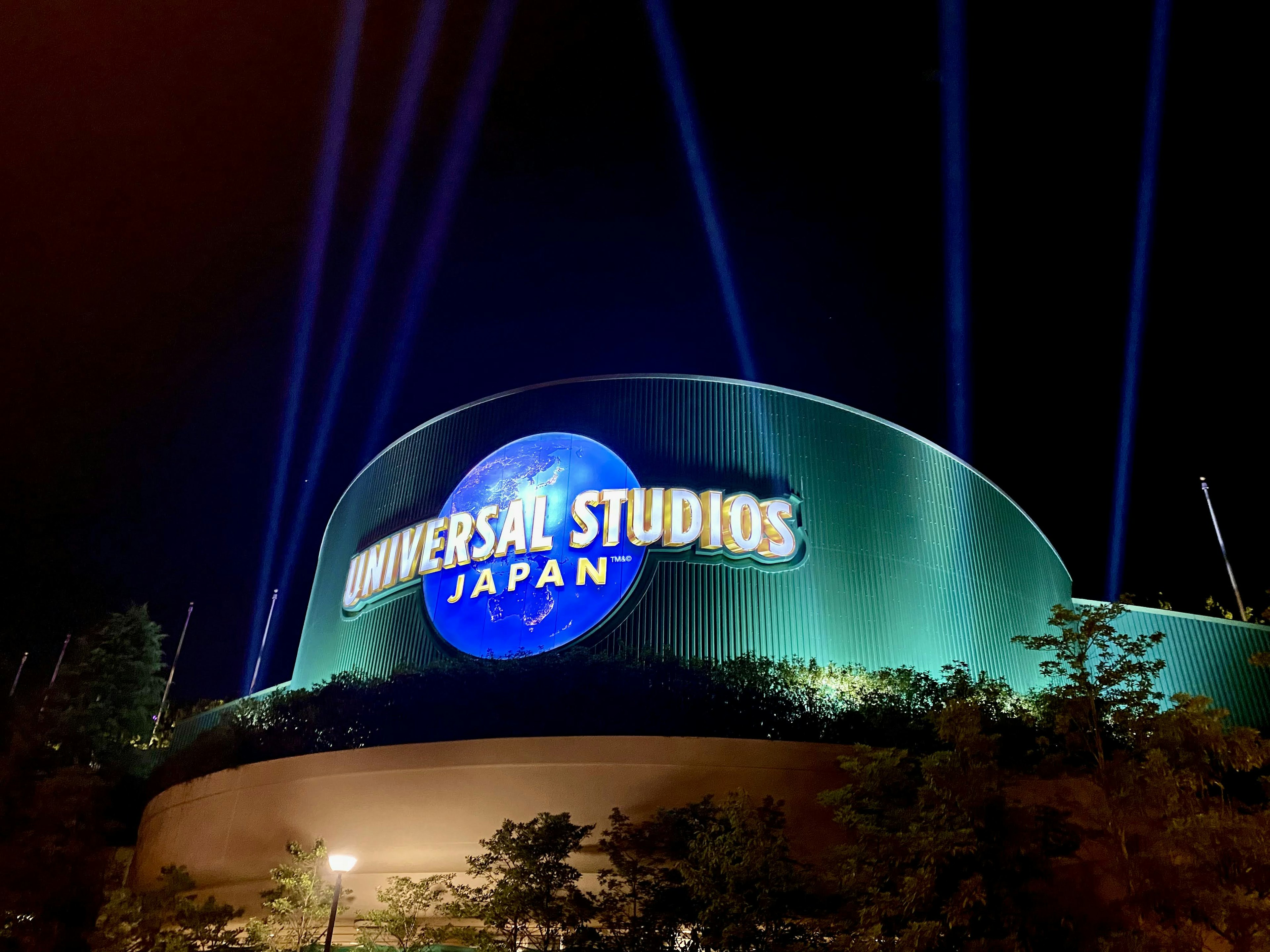 Night view of Universal Studios Japan with illuminated signage