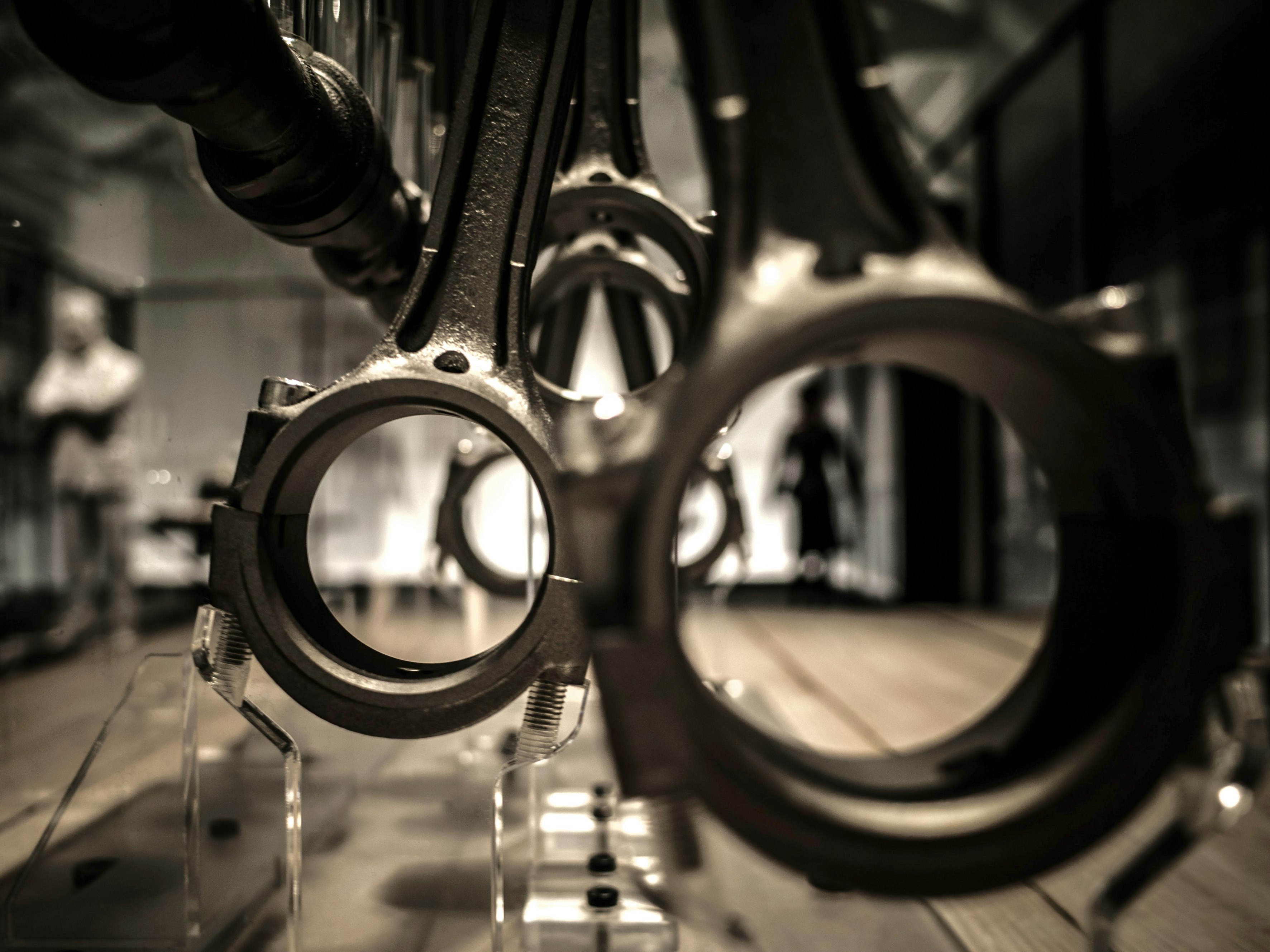 Industrial display of metal piston rods hanging