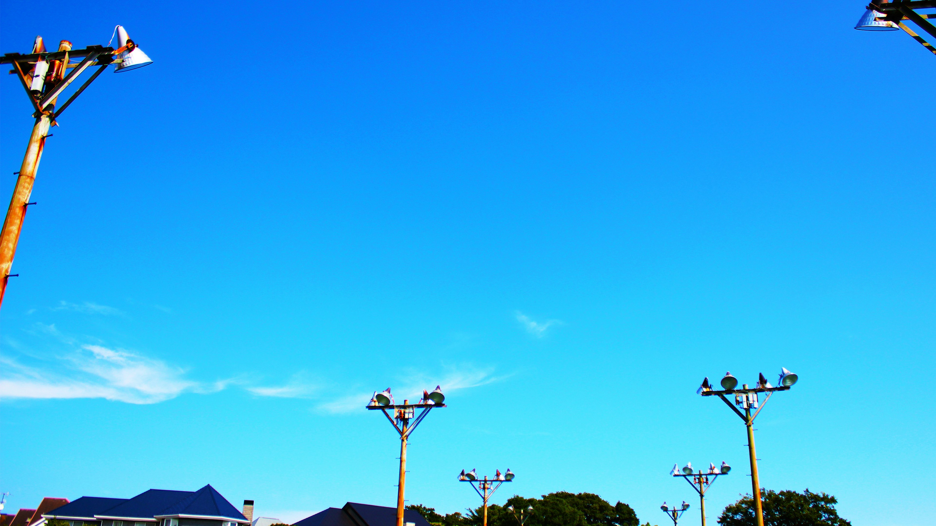 Clear blue sky with utility poles