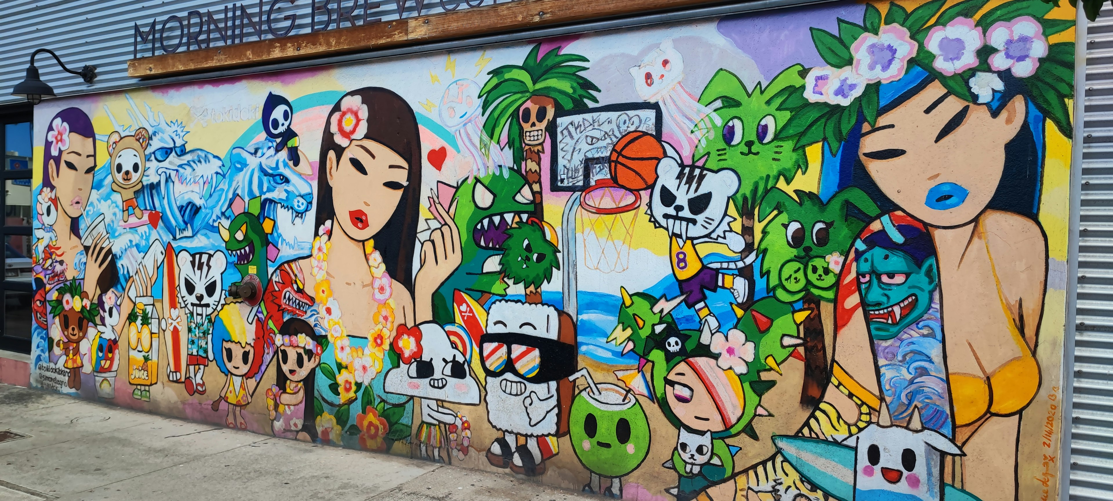 Colorful mural featuring characters and natural elements