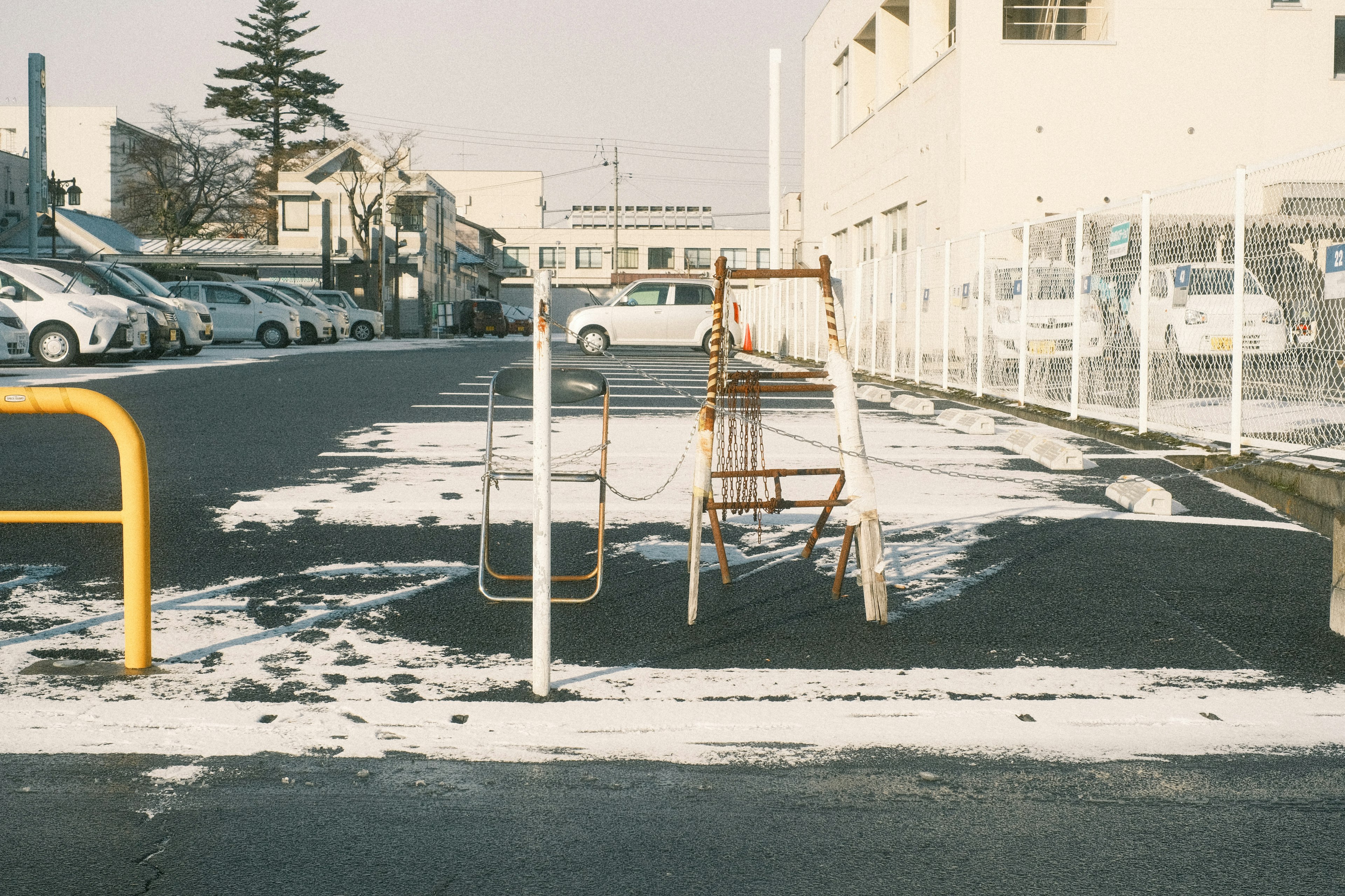 Playground equipment with a monkey bar and slide in a snowy area