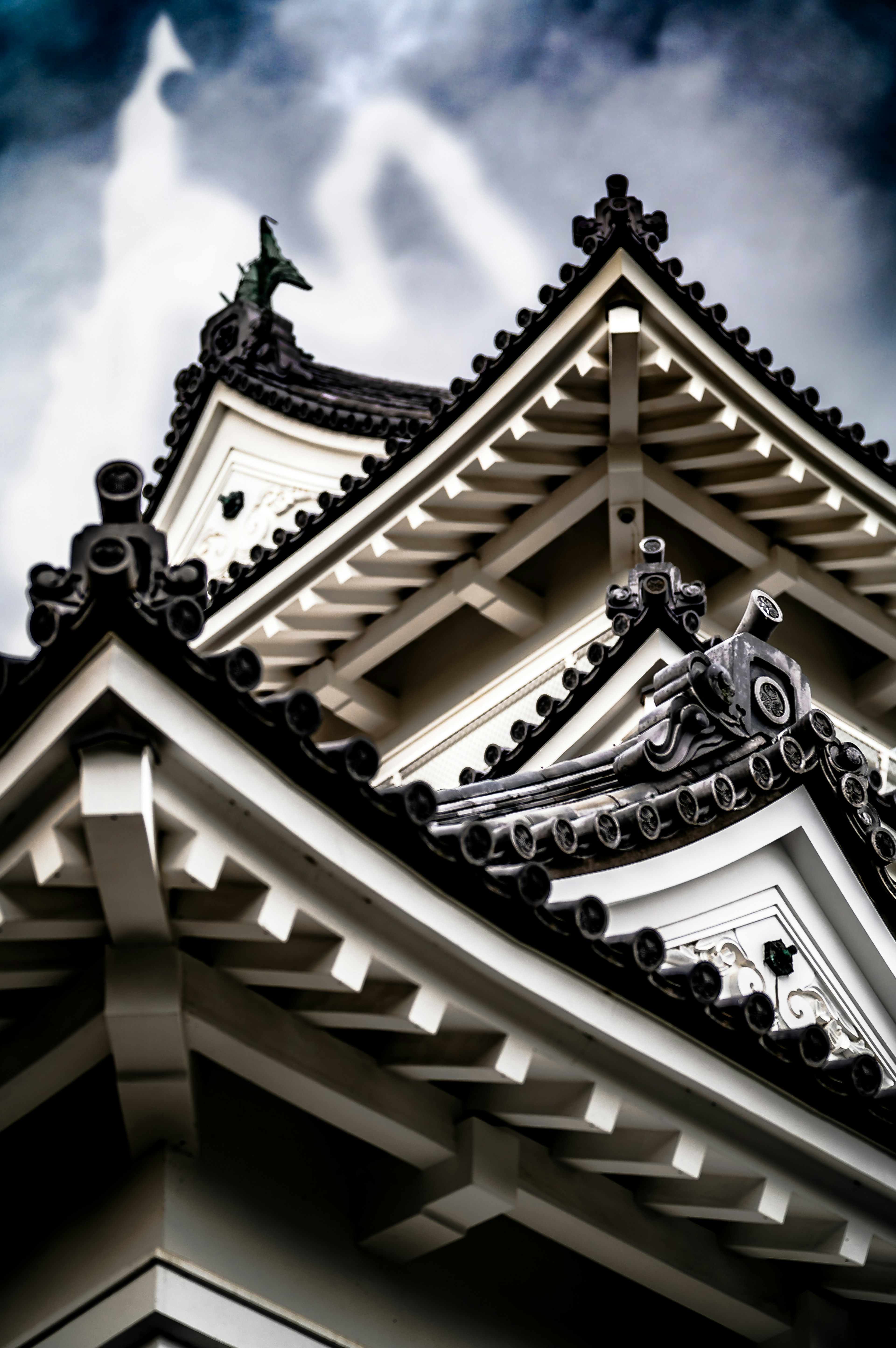 Detailed structure of a traditional Japanese building with white roofs