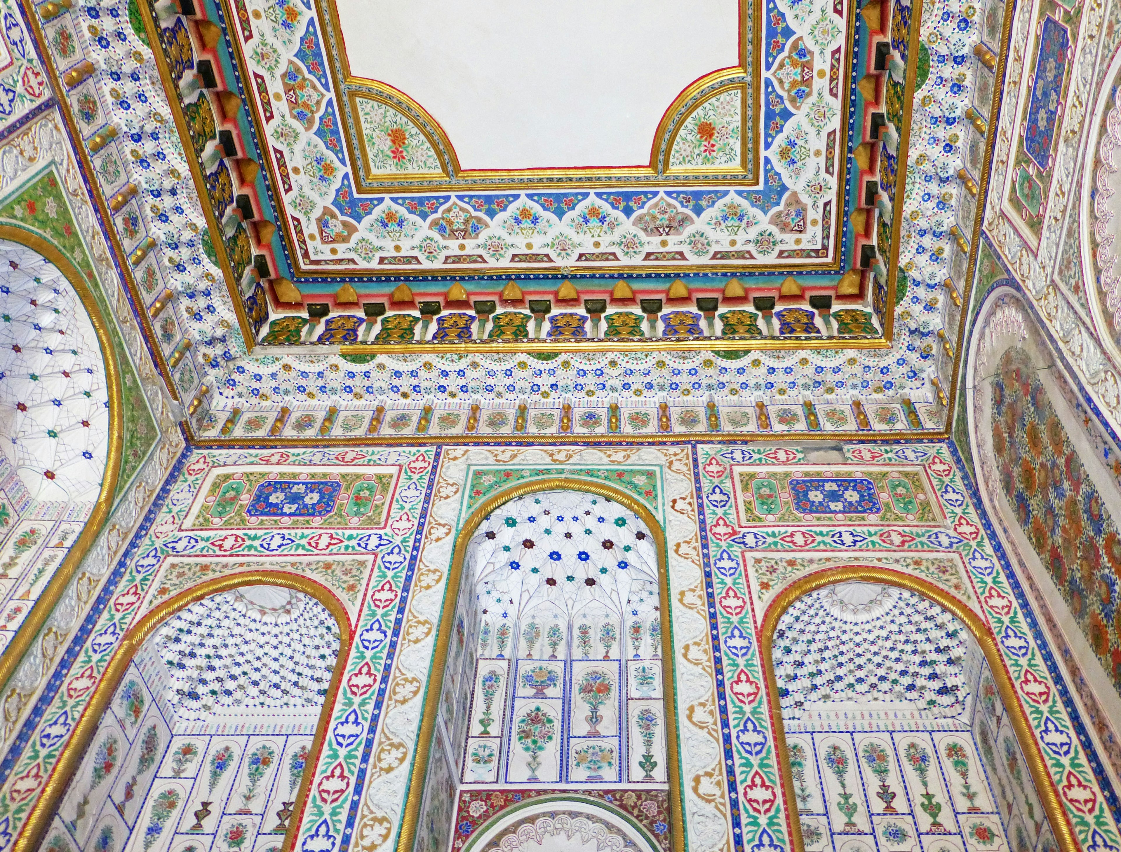 Intricate ceiling and wall designs of a beautifully decorated room