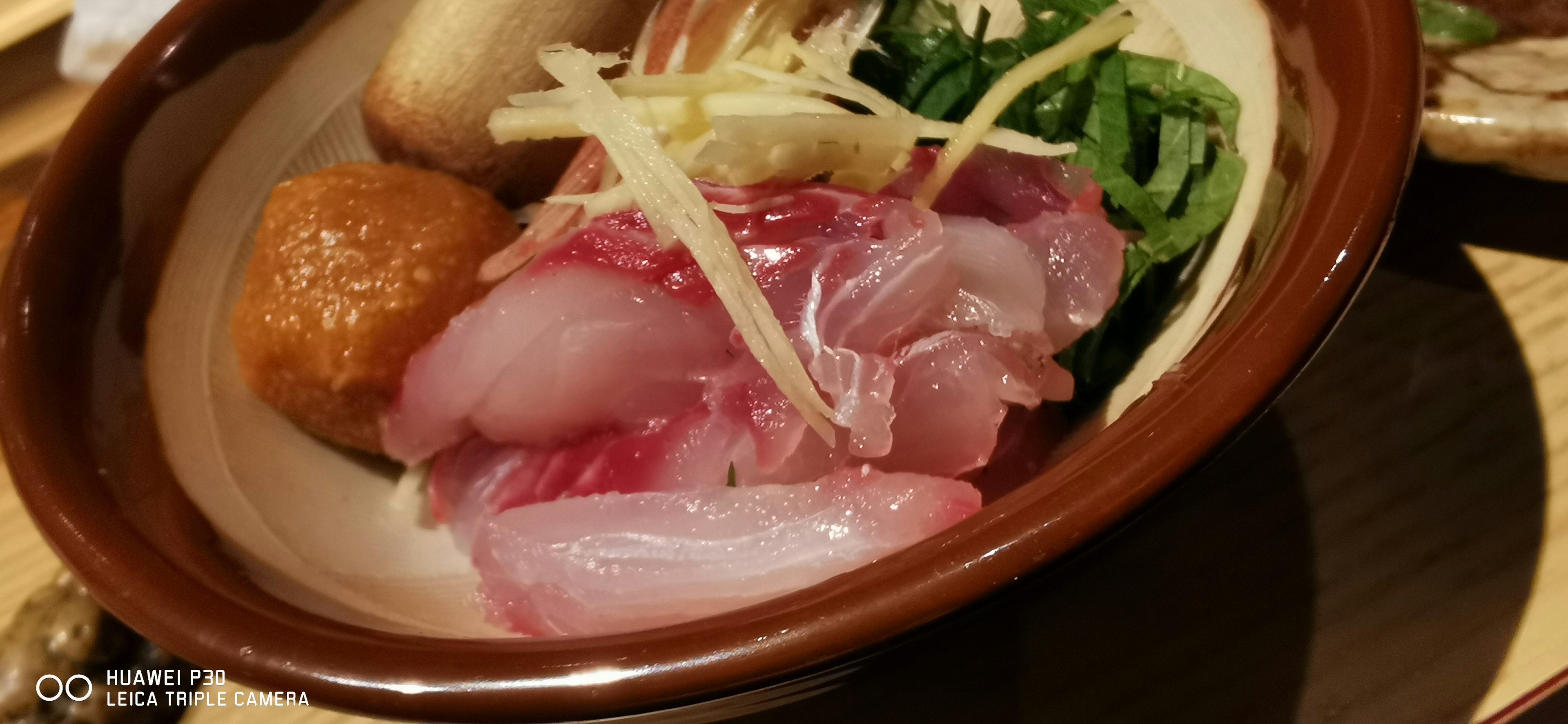 Fresh sashimi platter with garnishes