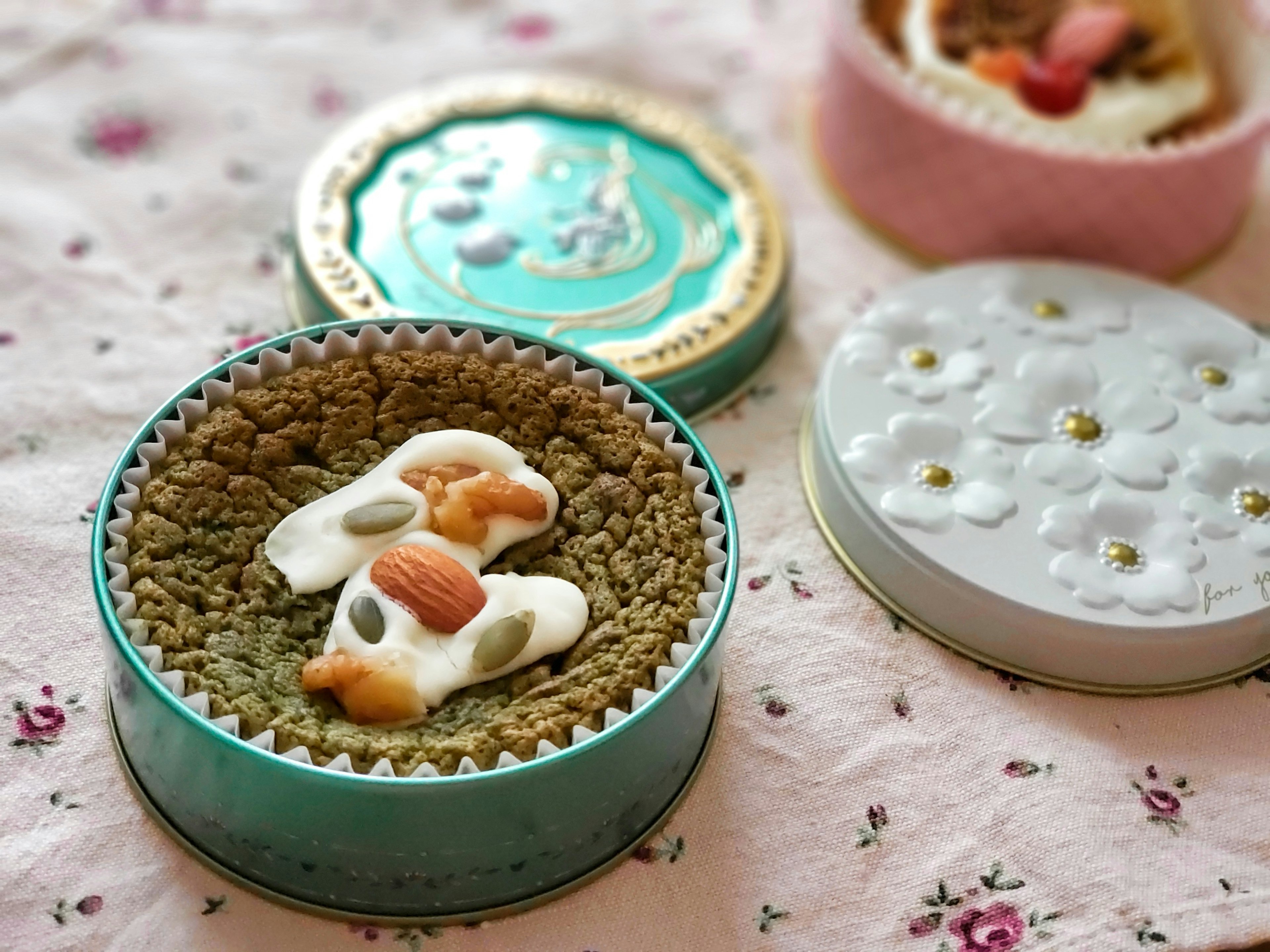 Decorative sweets and nuts displayed in a beautiful tin