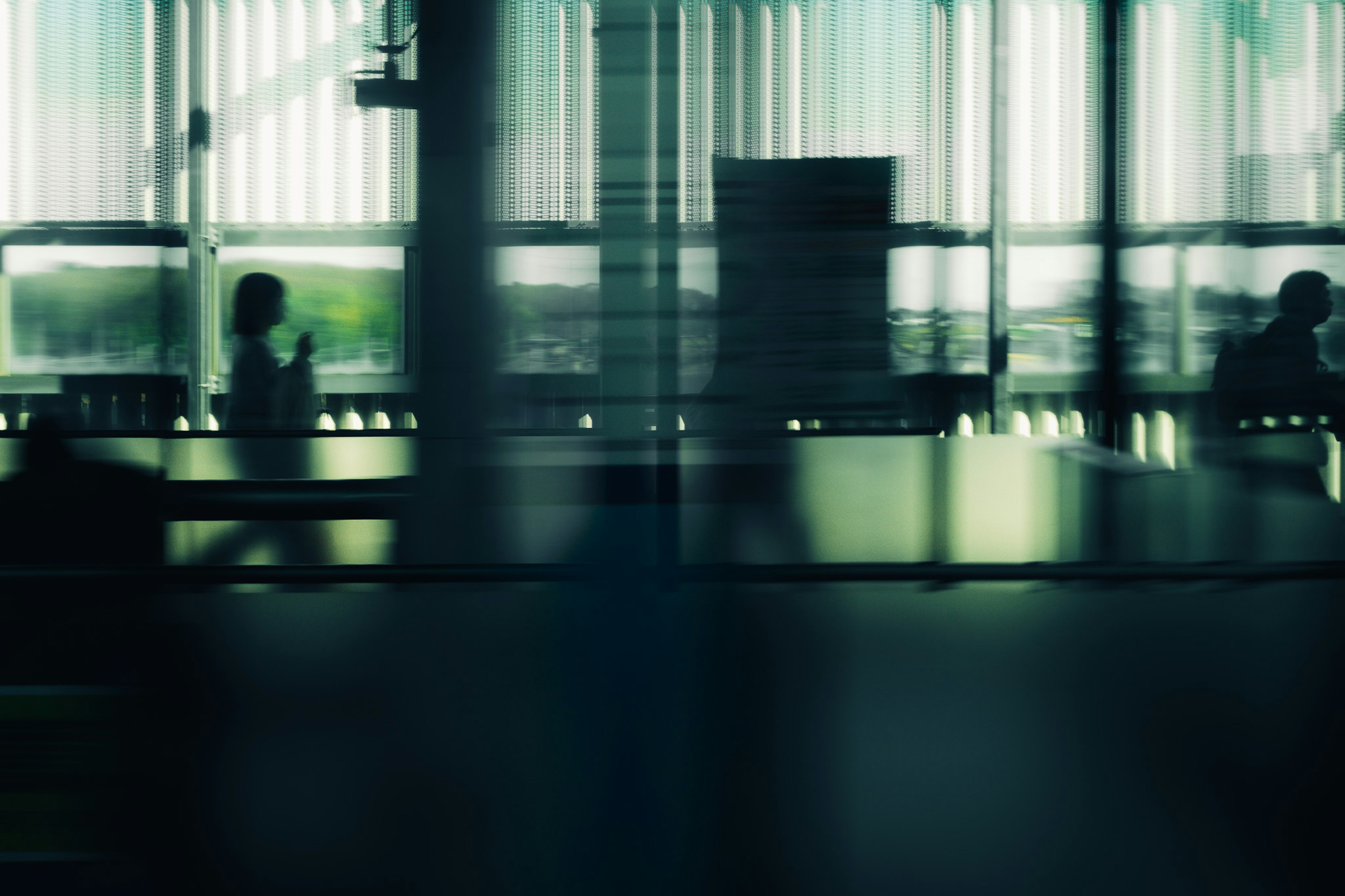 Blurred interior of an office with people sitting