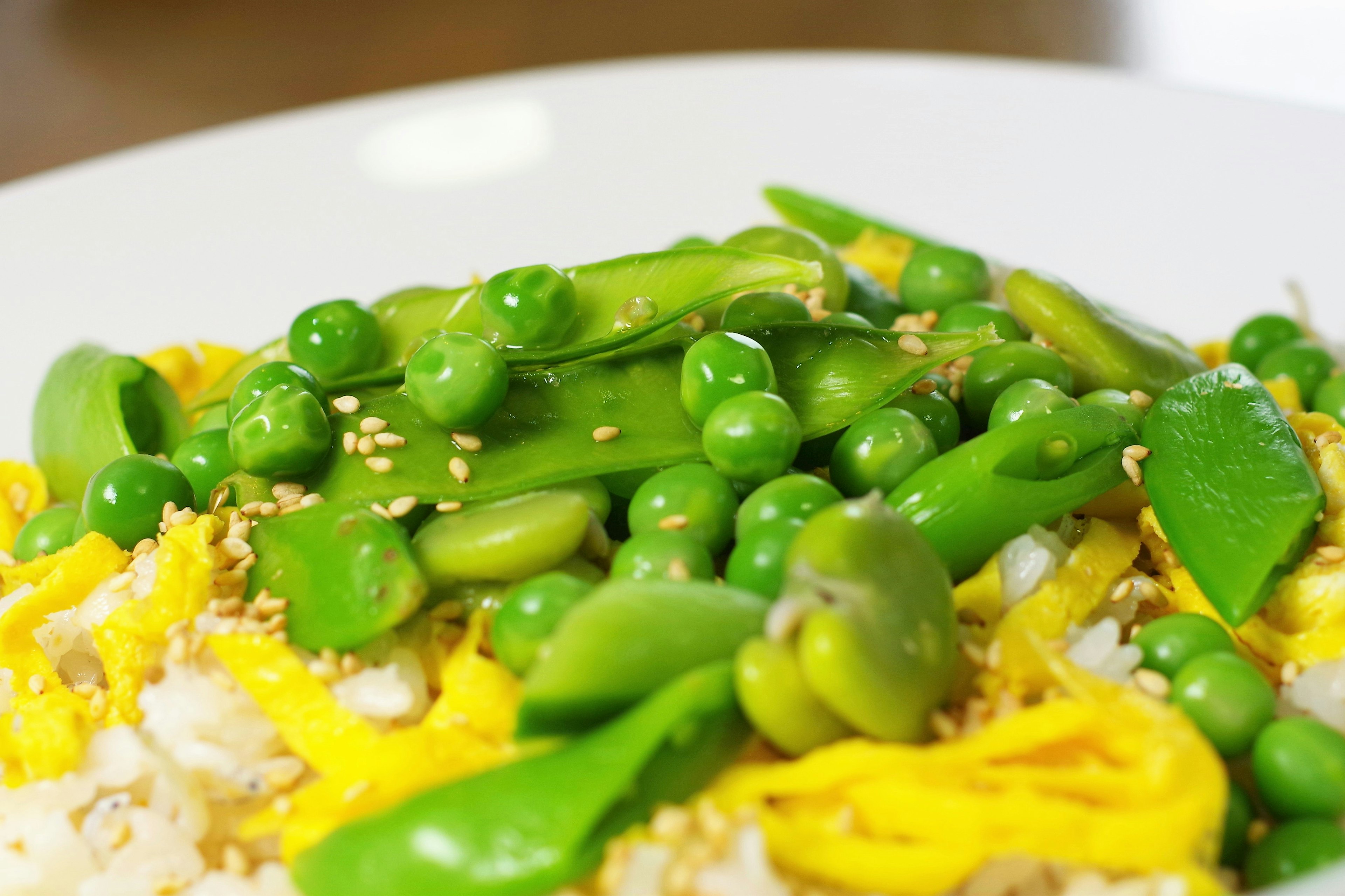 Colorful vegetables topped with sesame on rice