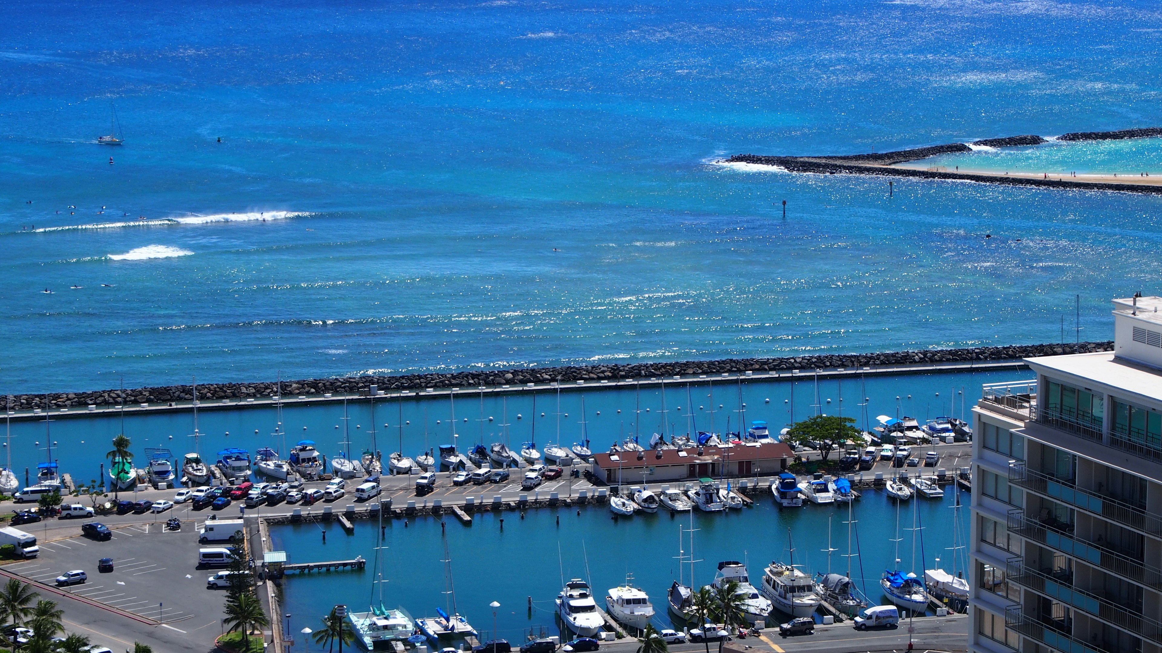 A scenic view of a marina with boats and turquoise waters