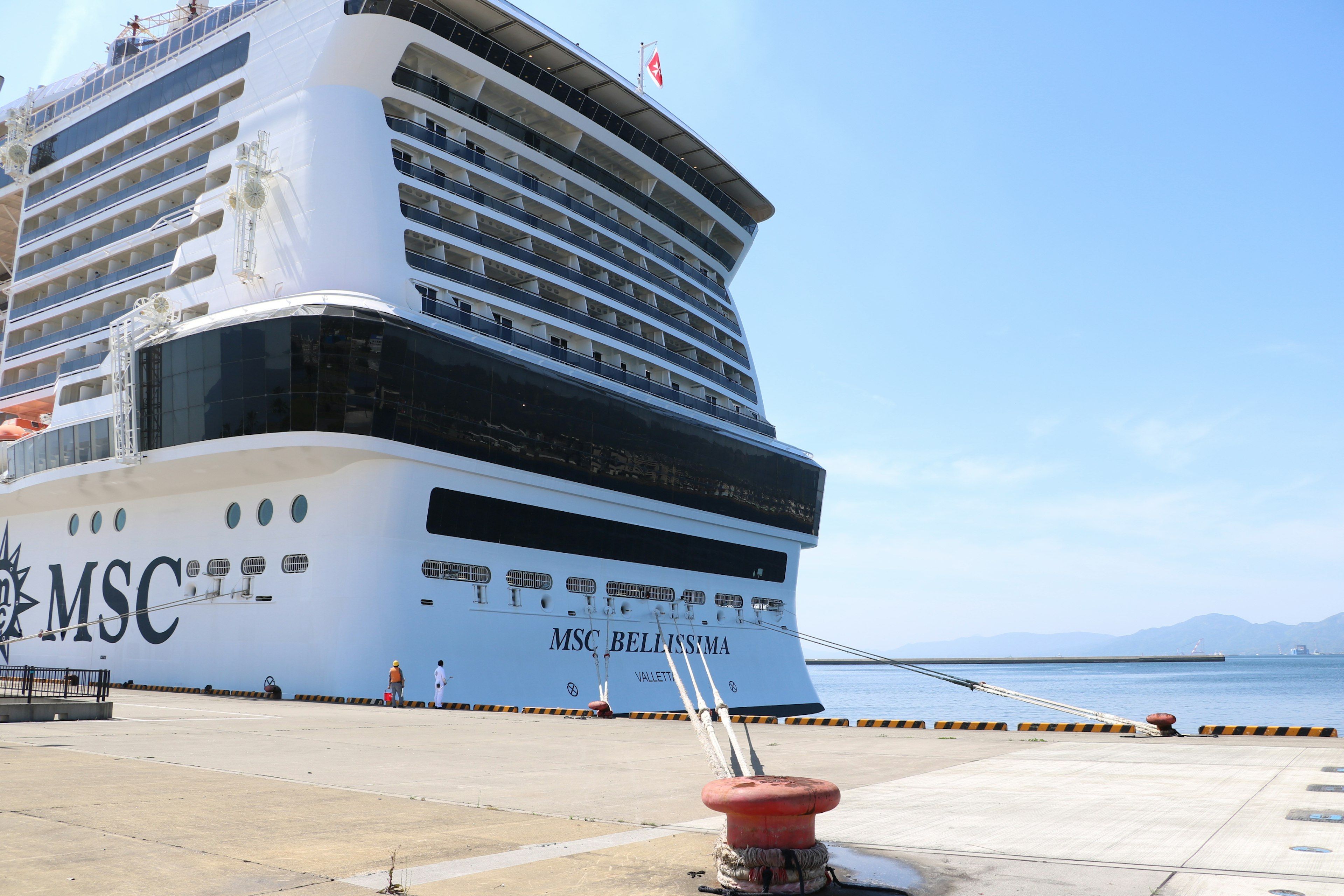 MSC cruise ship docked at the harbor under bright sunlight