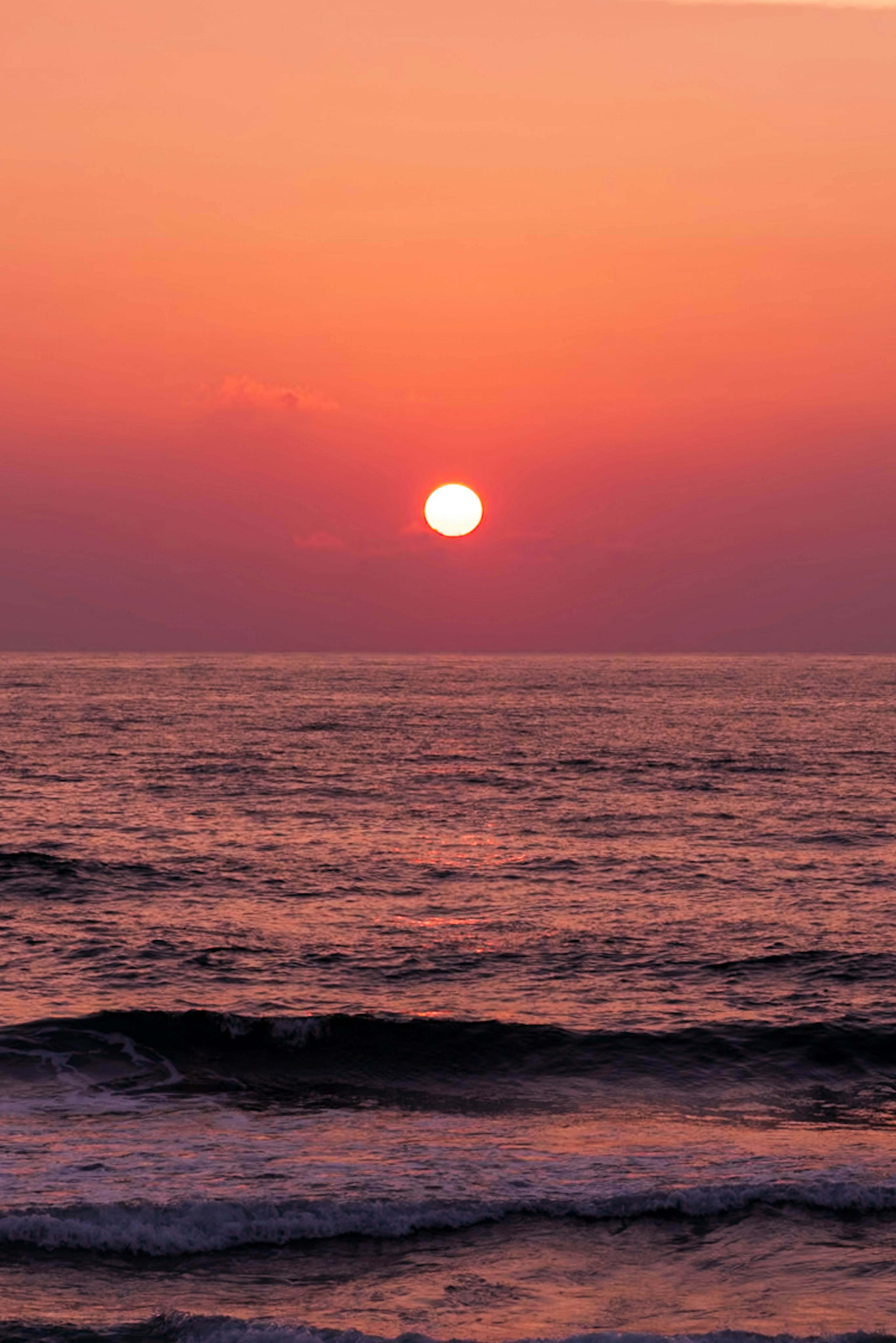 Beautiful orange sunset over the ocean horizon