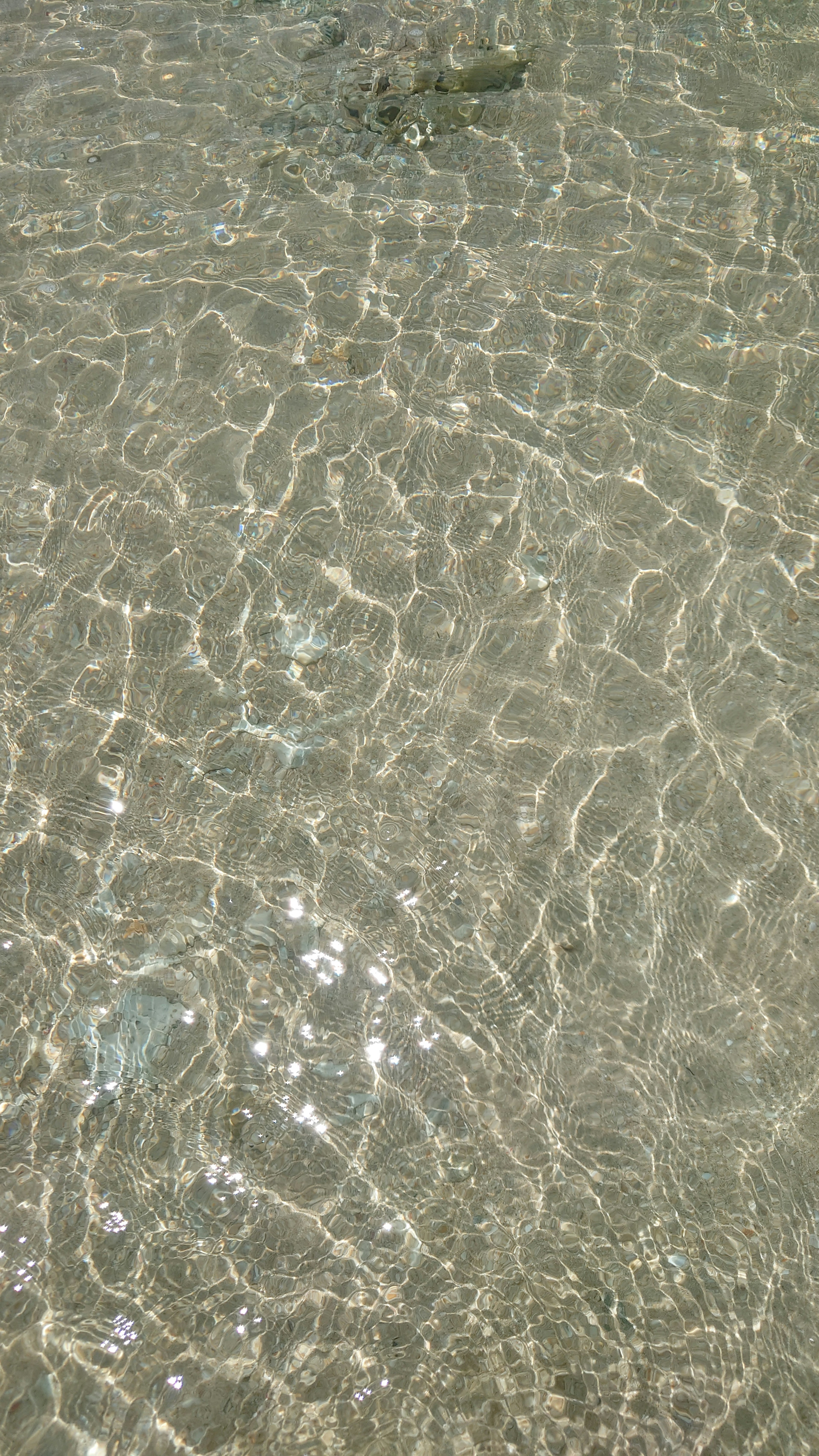 Beautiful reflection of light on a clear water surface