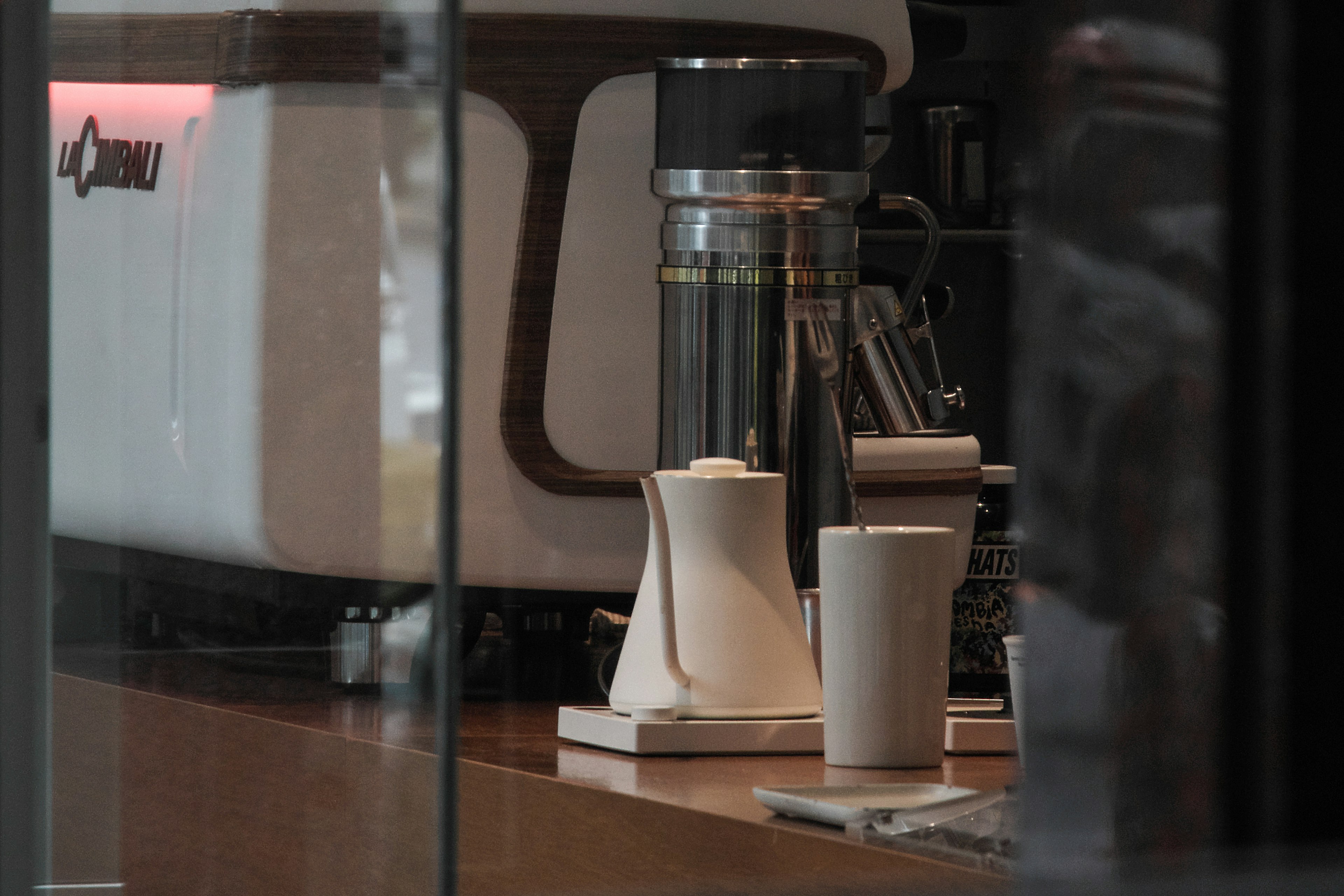 Coffee machine and white pot inside a cafe