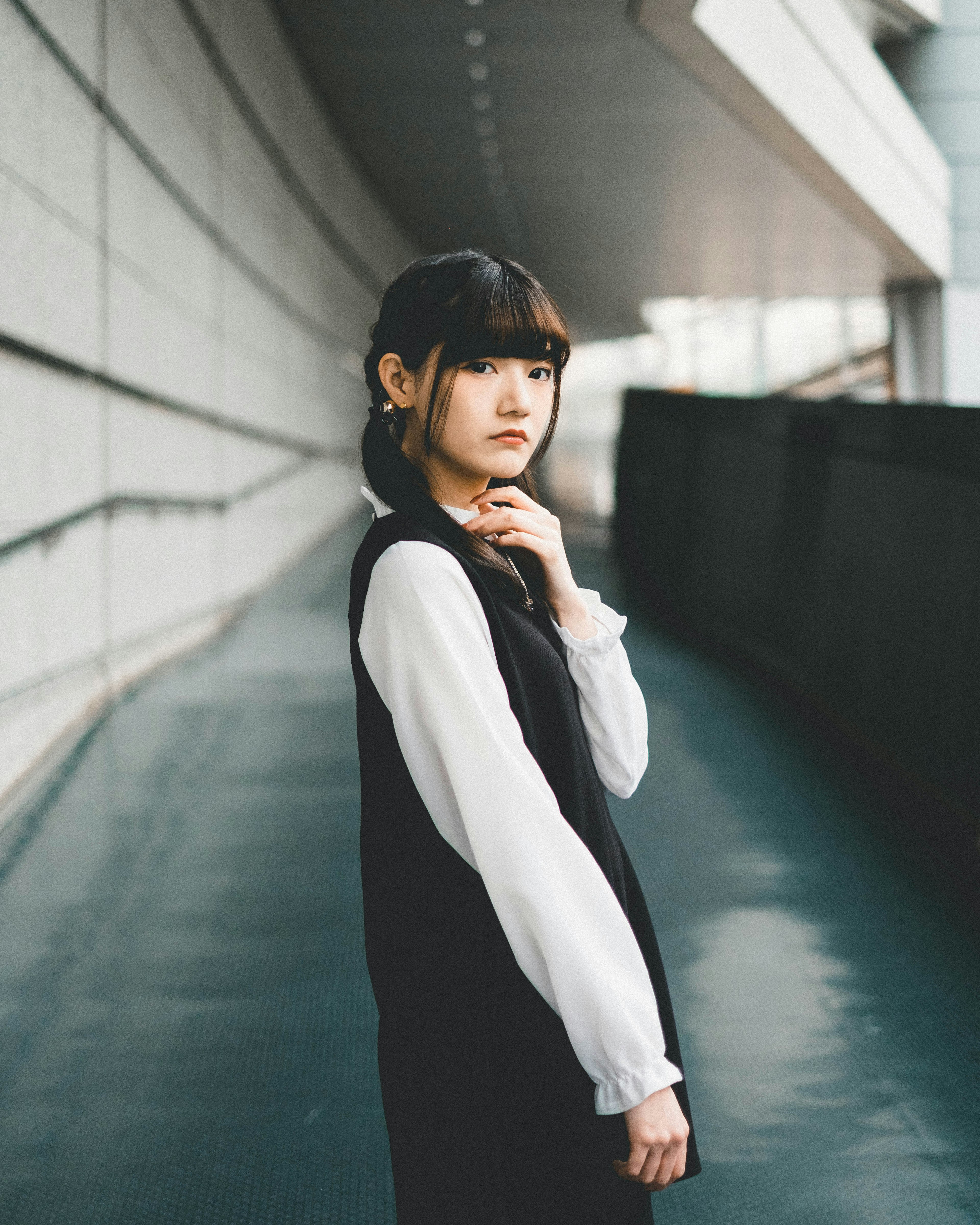 Portrait of a woman with modern architecture in the background