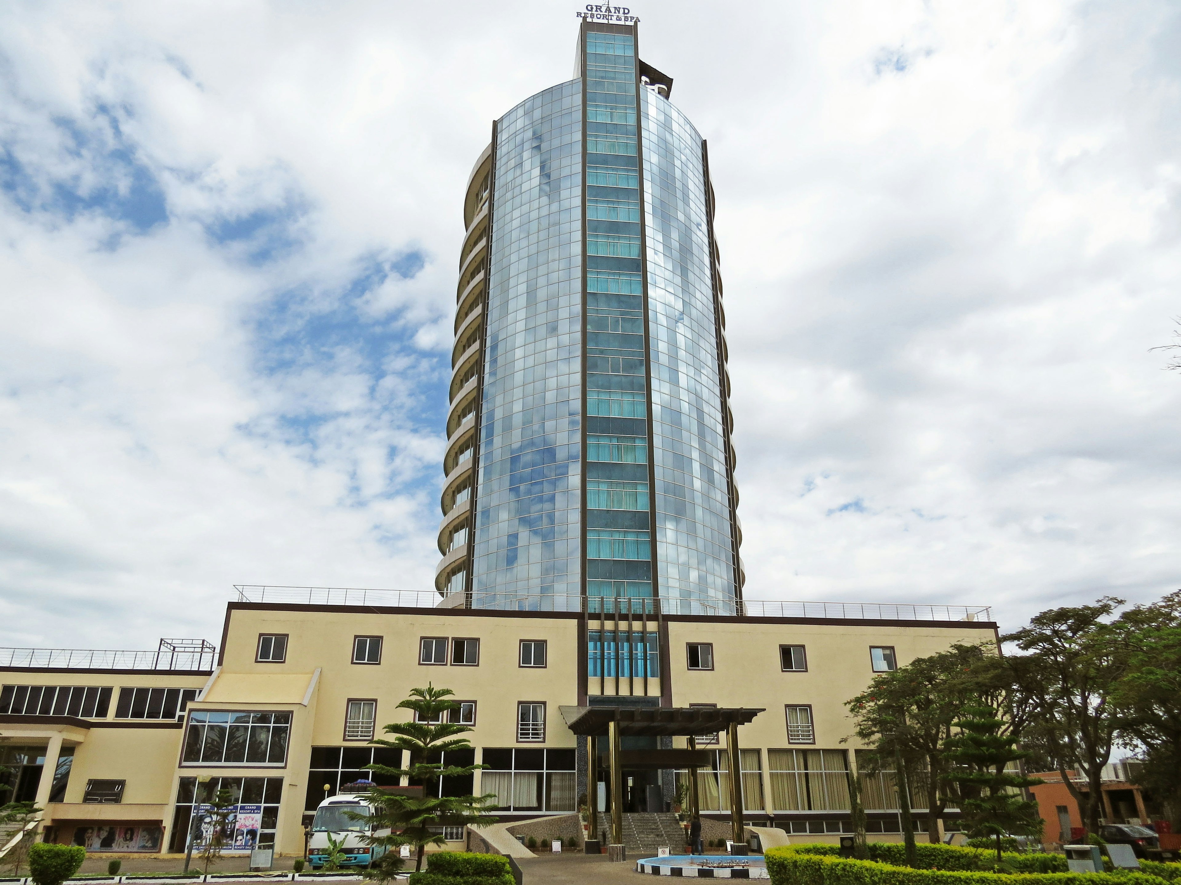 Modern high-rise building with reflective glass and unique architecture