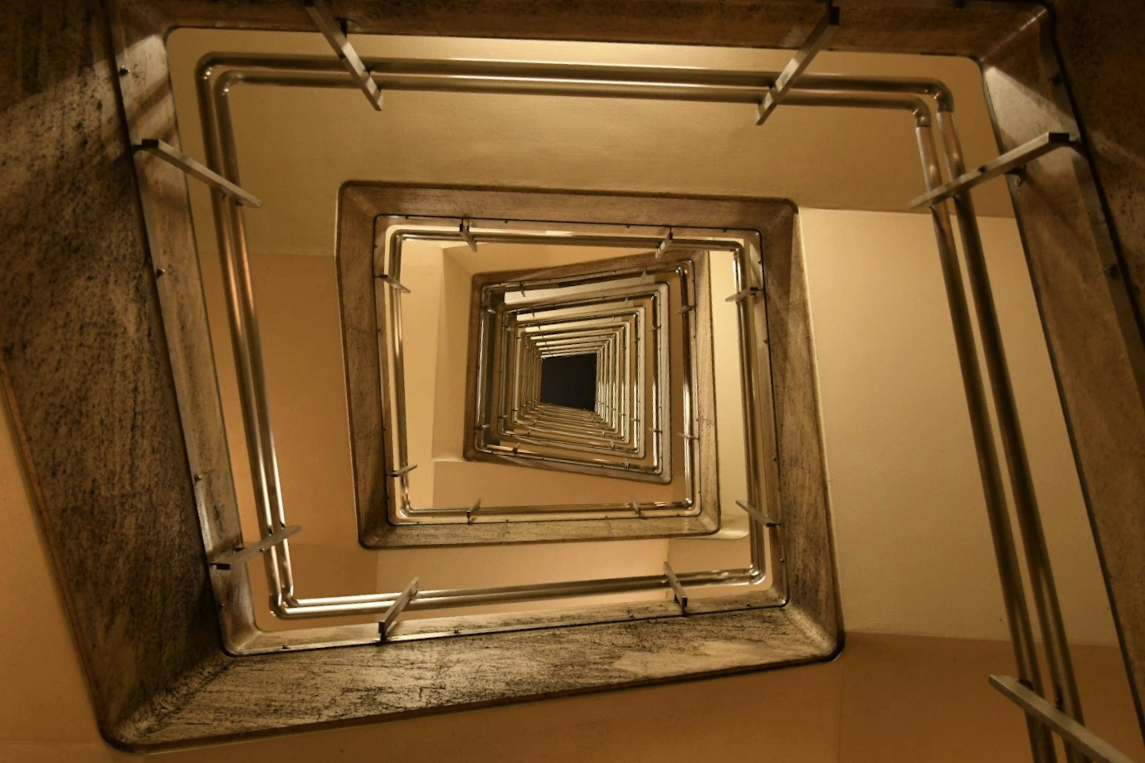 Image showing a spiral staircase viewed from below