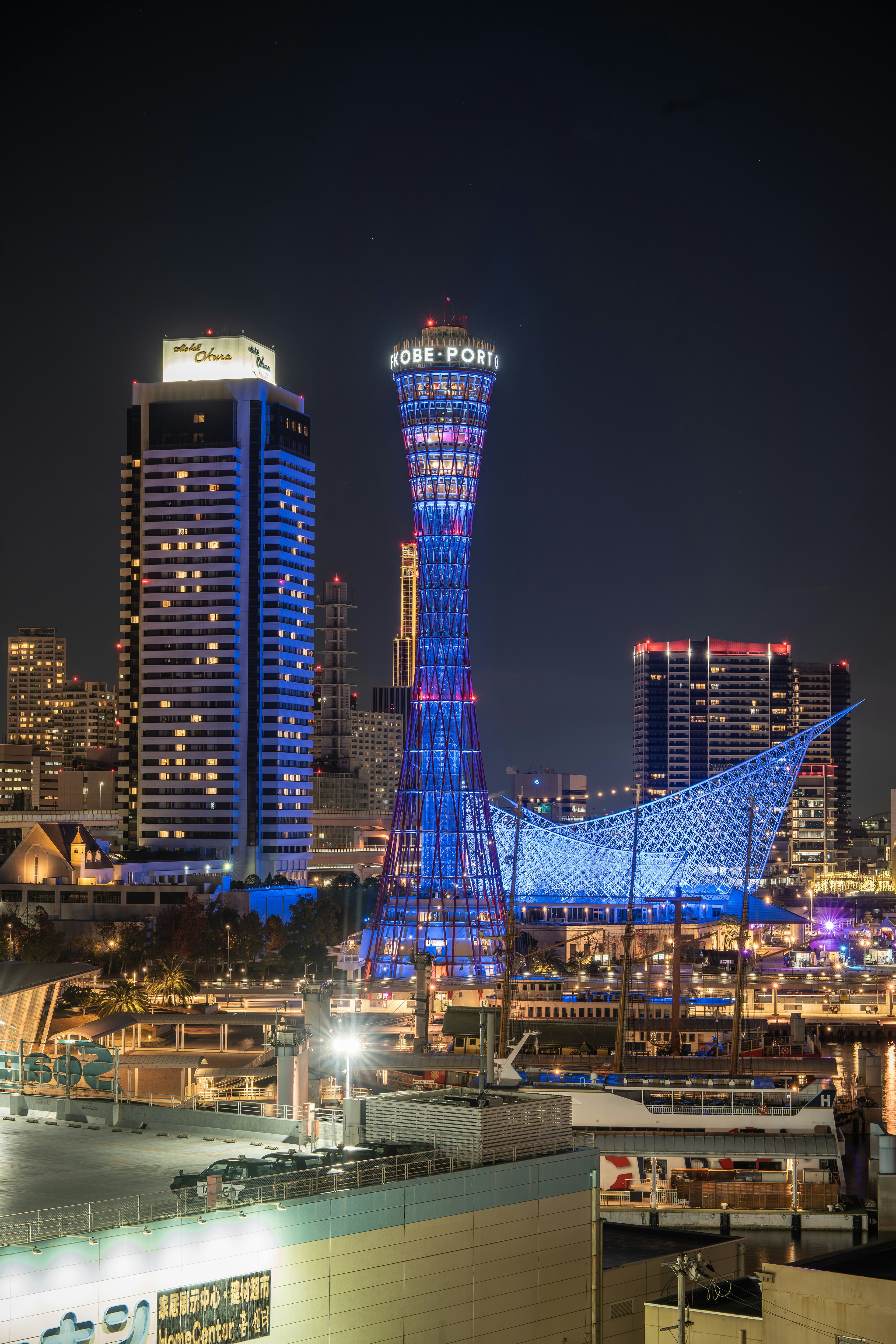 Illuminated Las Vegas skyline at night featuring high-rise buildings and the Stratosphere Tower