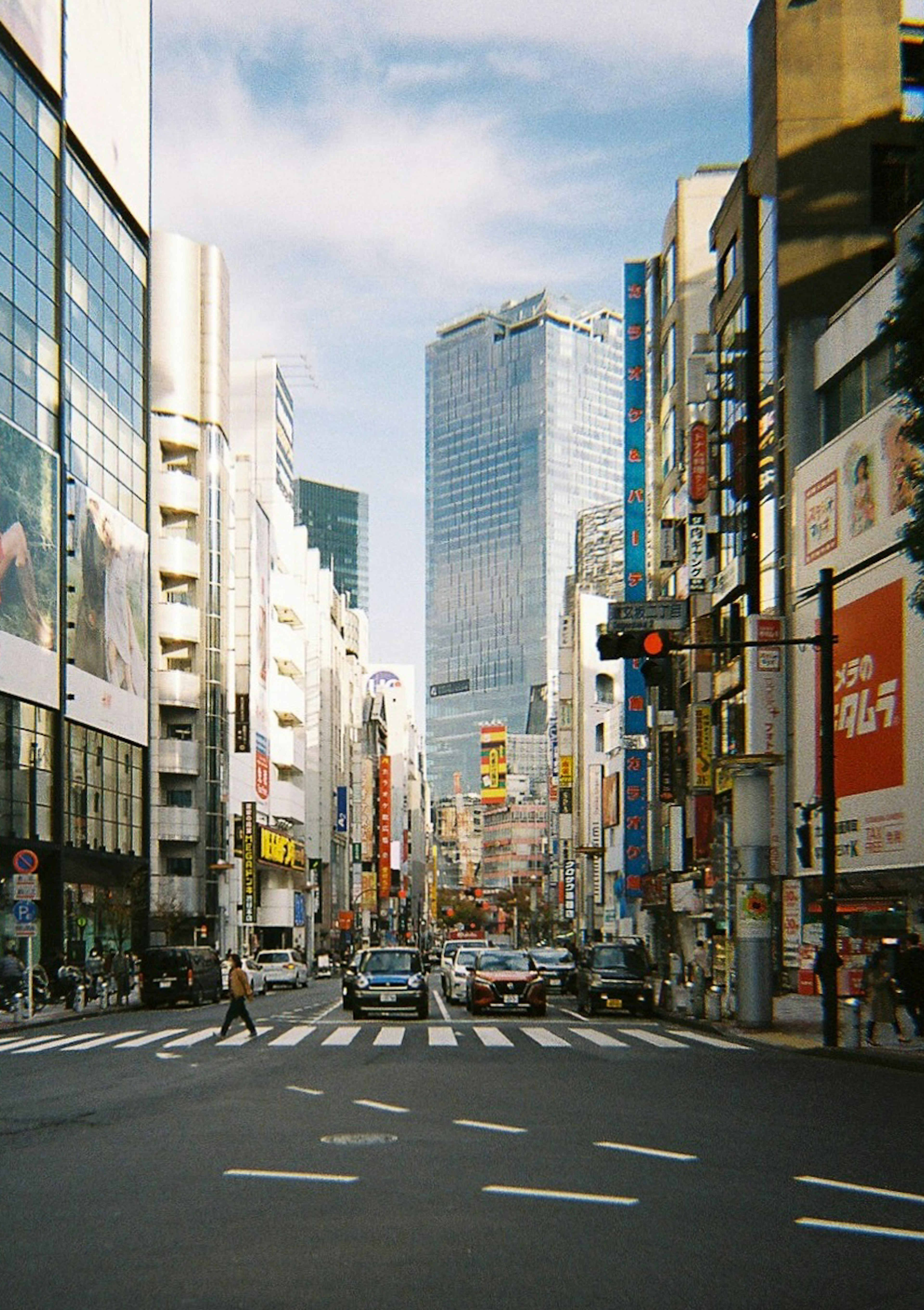 Urban intersection featuring skyscrapers and bustling traffic