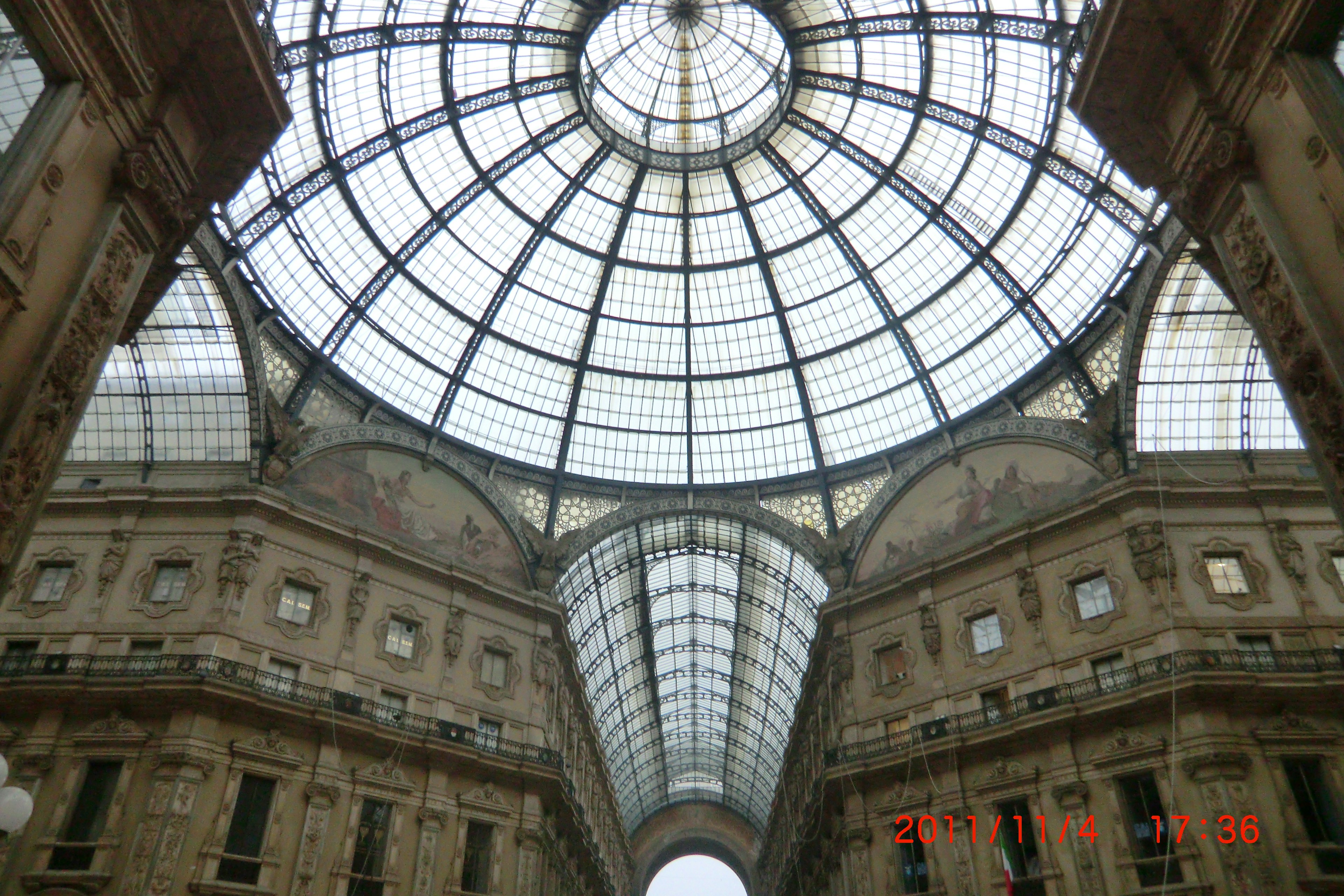 Interior of a historic building featuring a grand glass dome