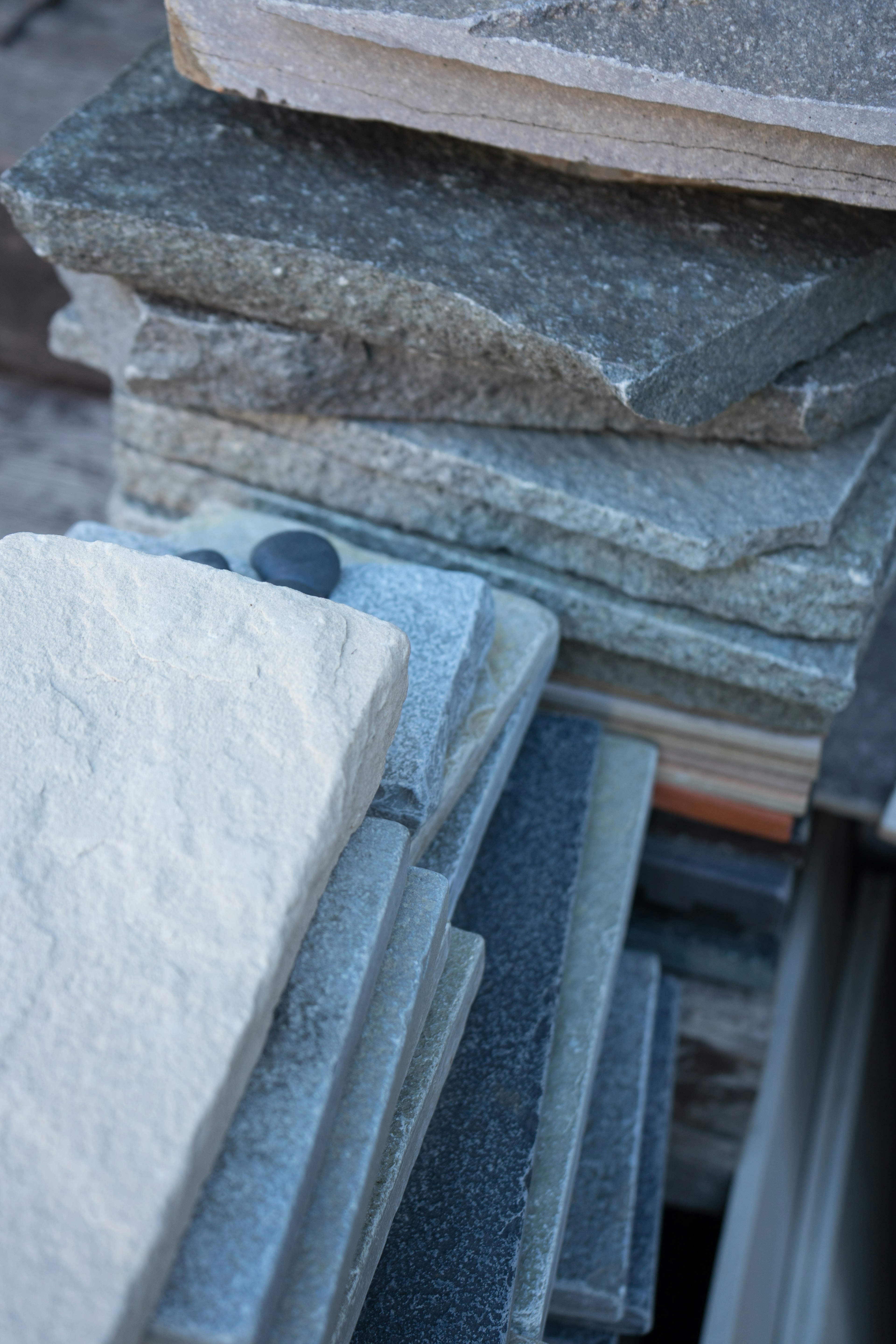 Stack of various stone slabs in different colors and textures