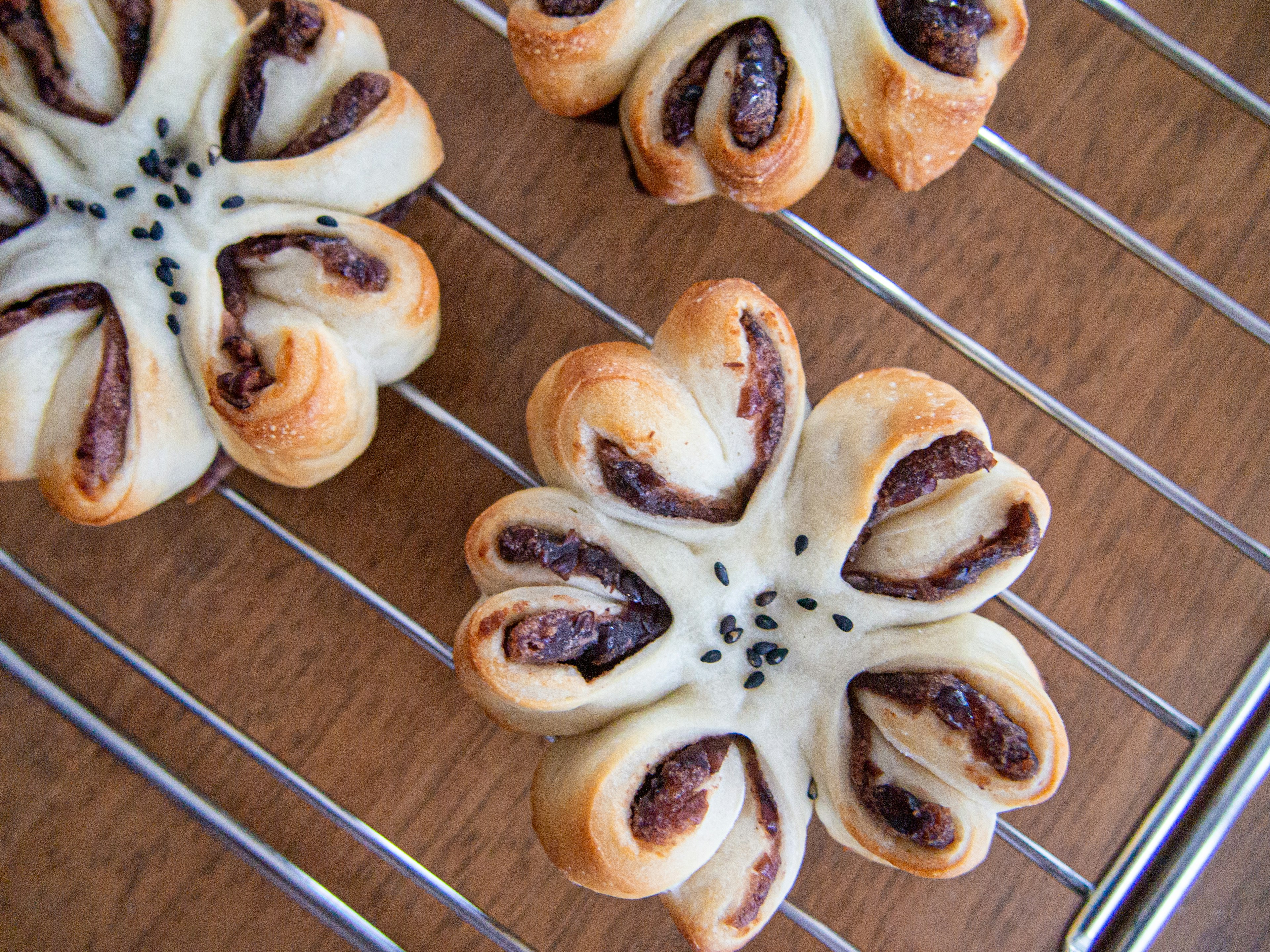 Freshly baked flower-shaped bread on a wire rack