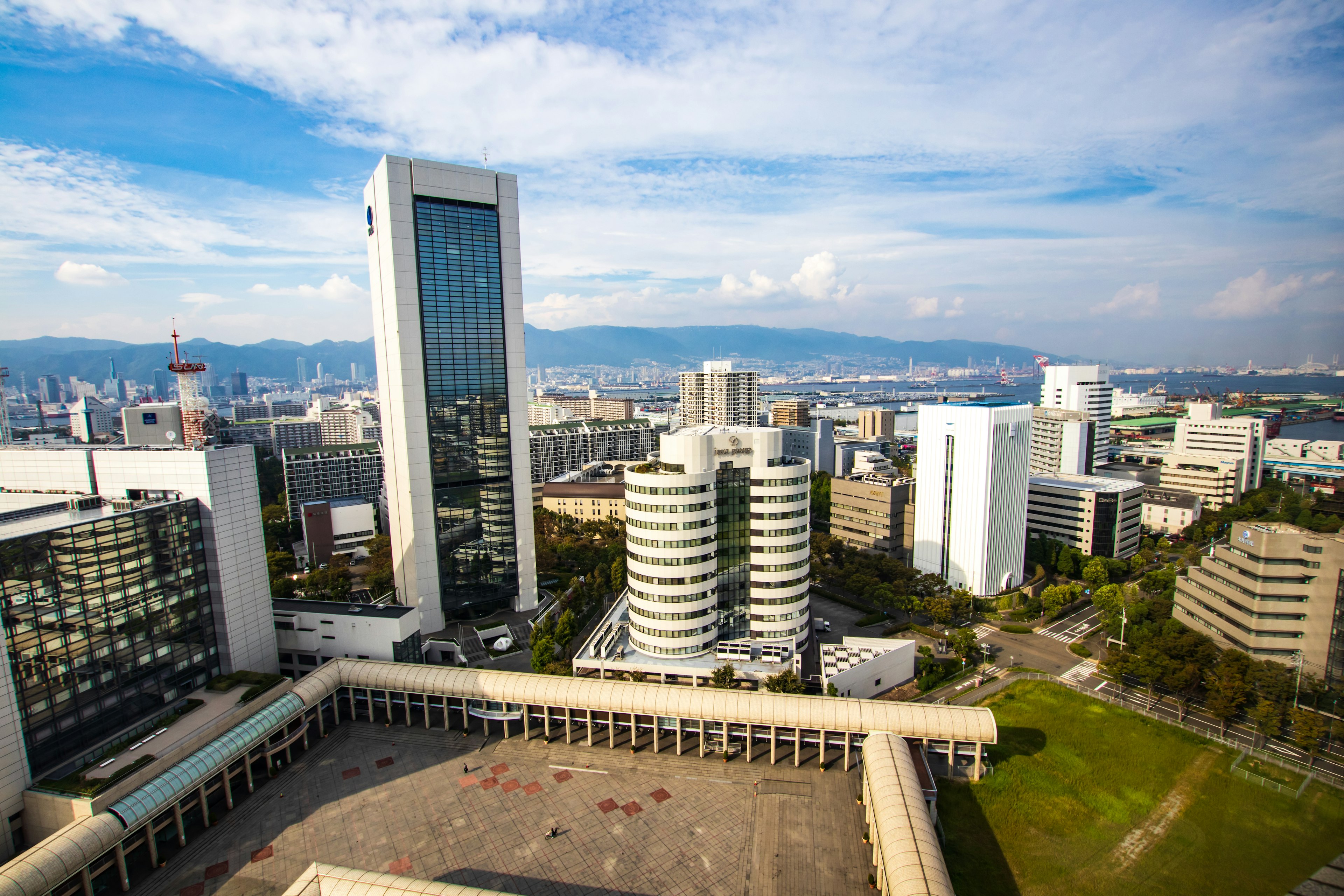 Cityscape featuring skyscrapers and an open plaza