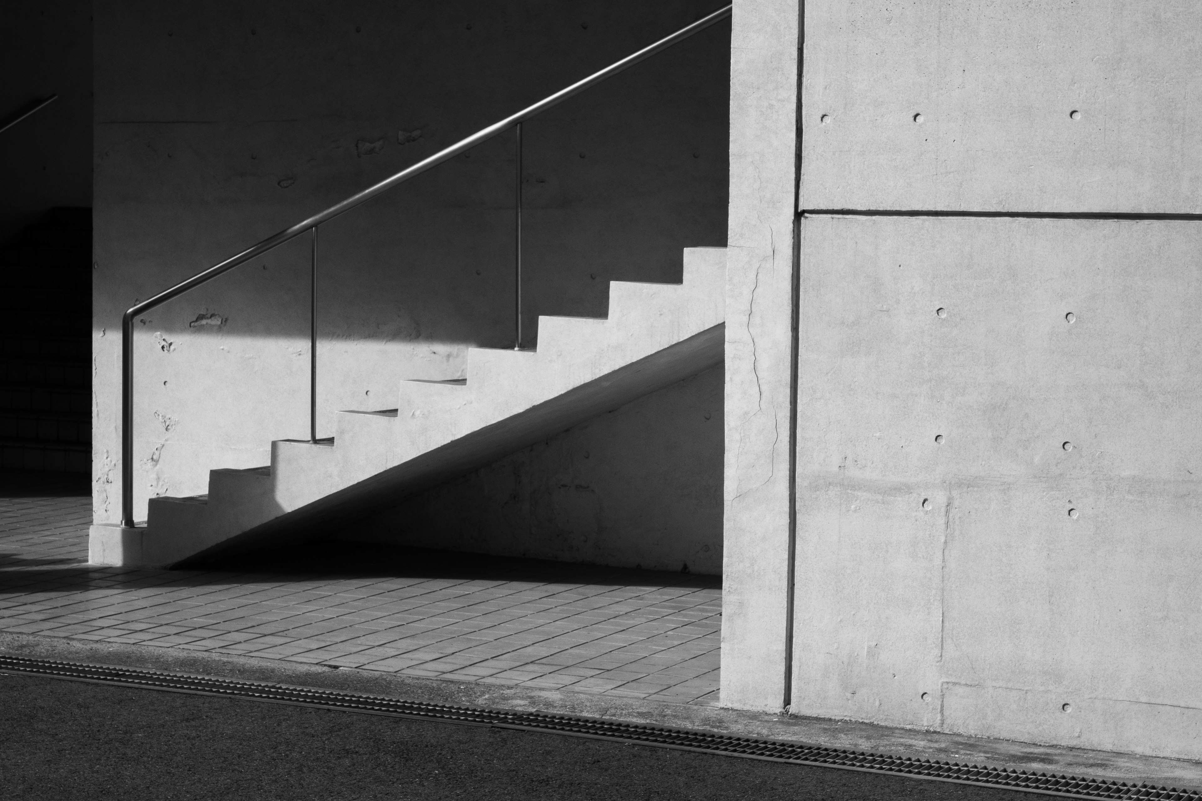 Monochrome image of concrete stairs and wall