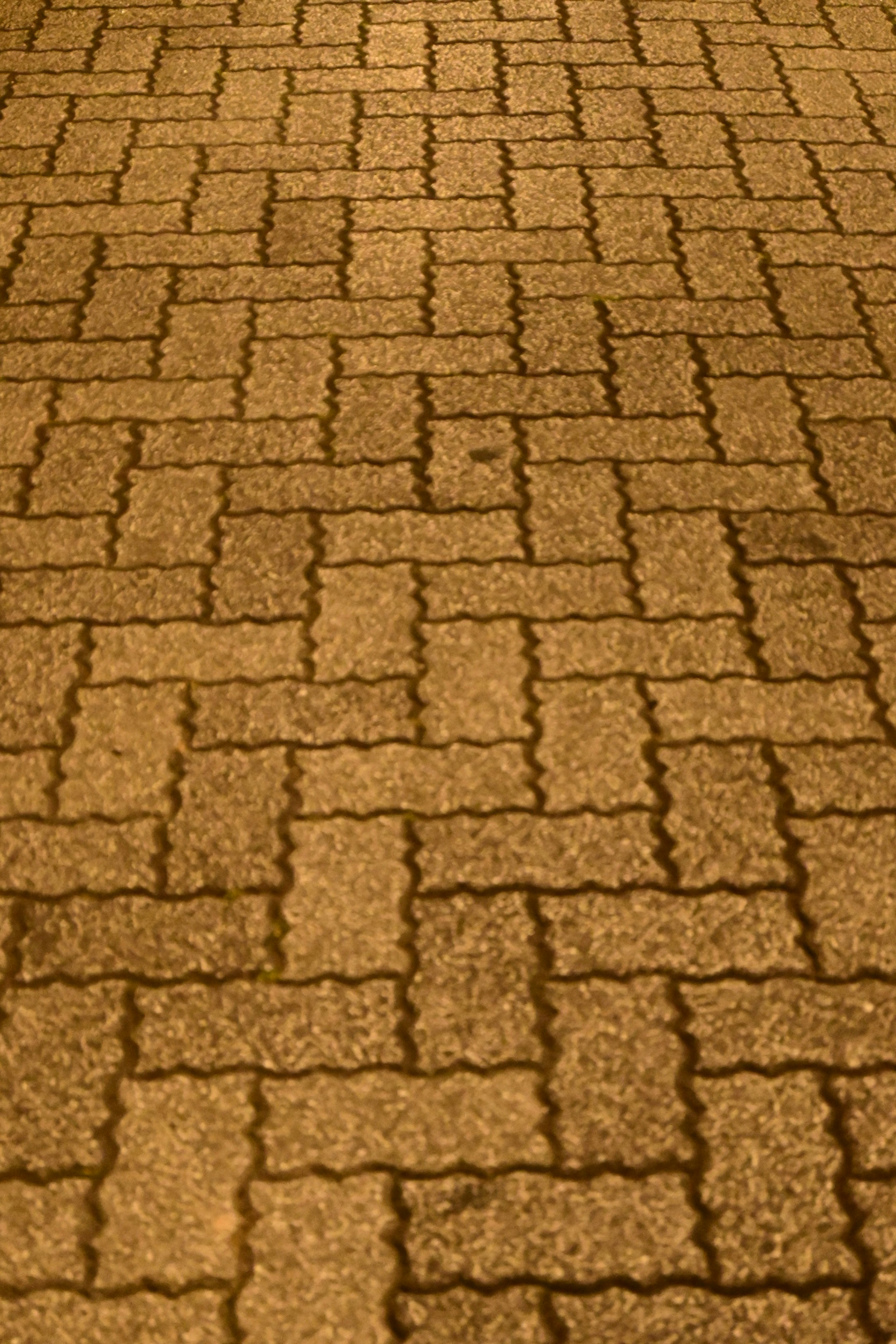 Patterned cobblestone pavement with a warm hue