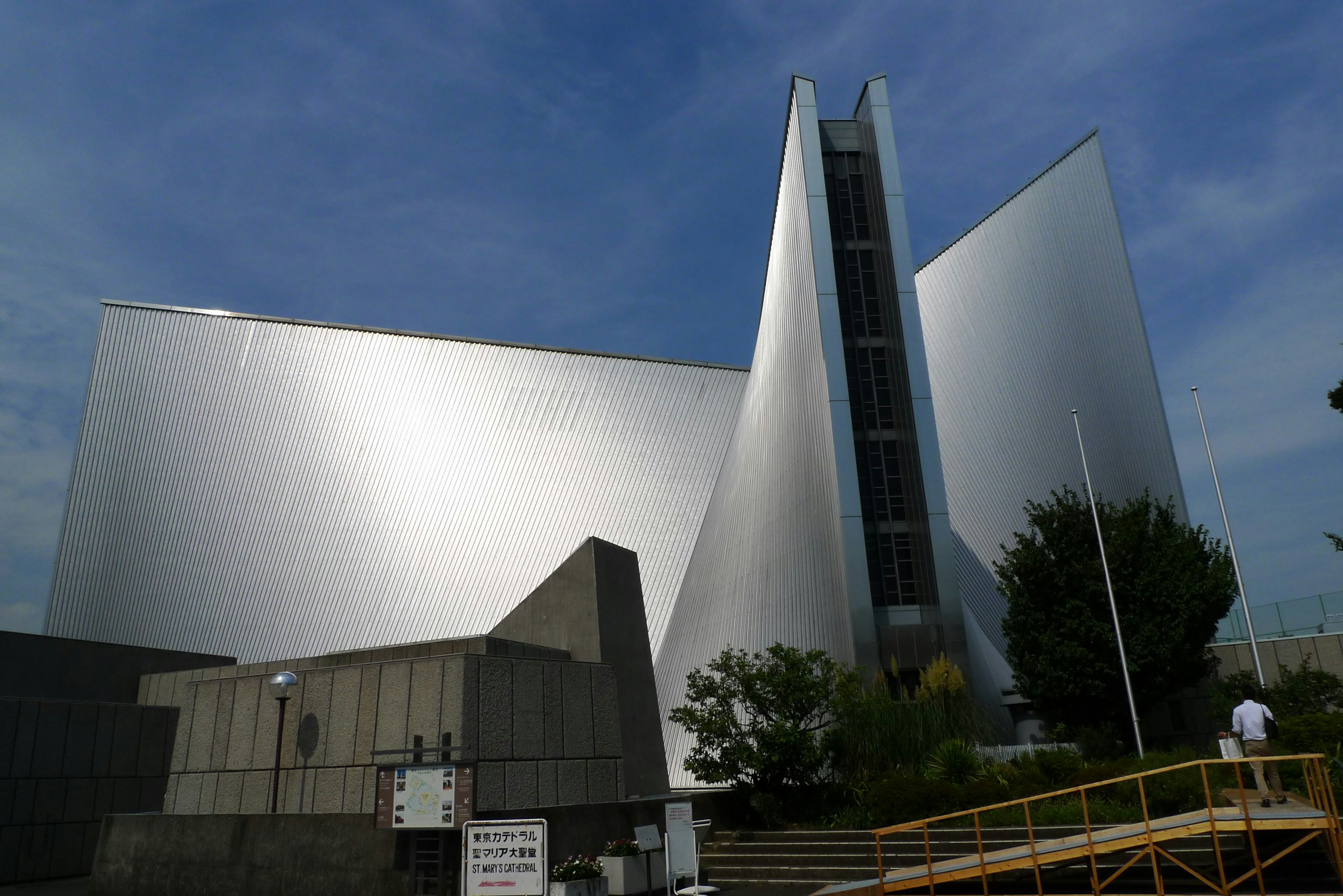 Contemporary architectural structure with metallic surfaces and unique angular design