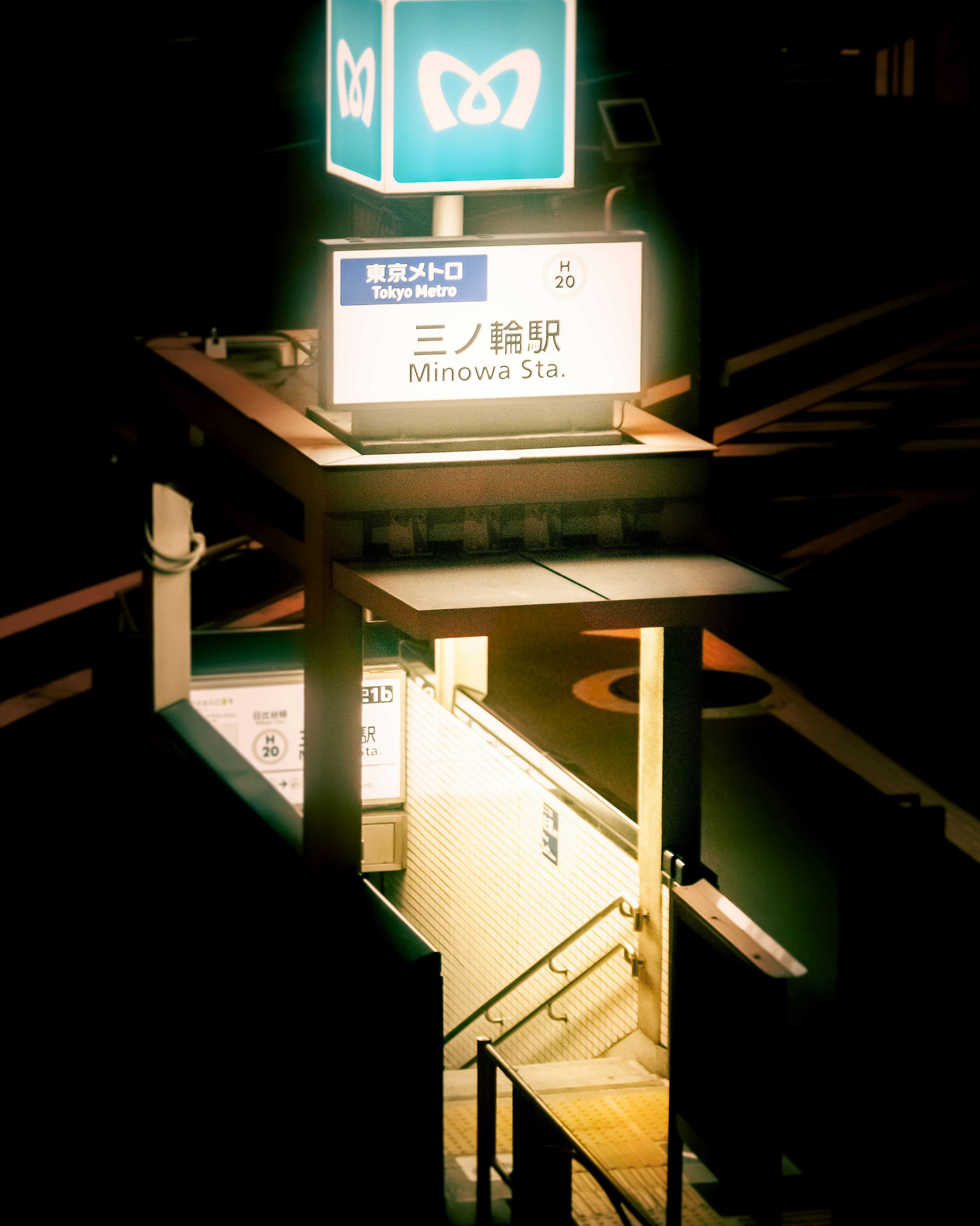 Night view of Minowa Station sign and stairs